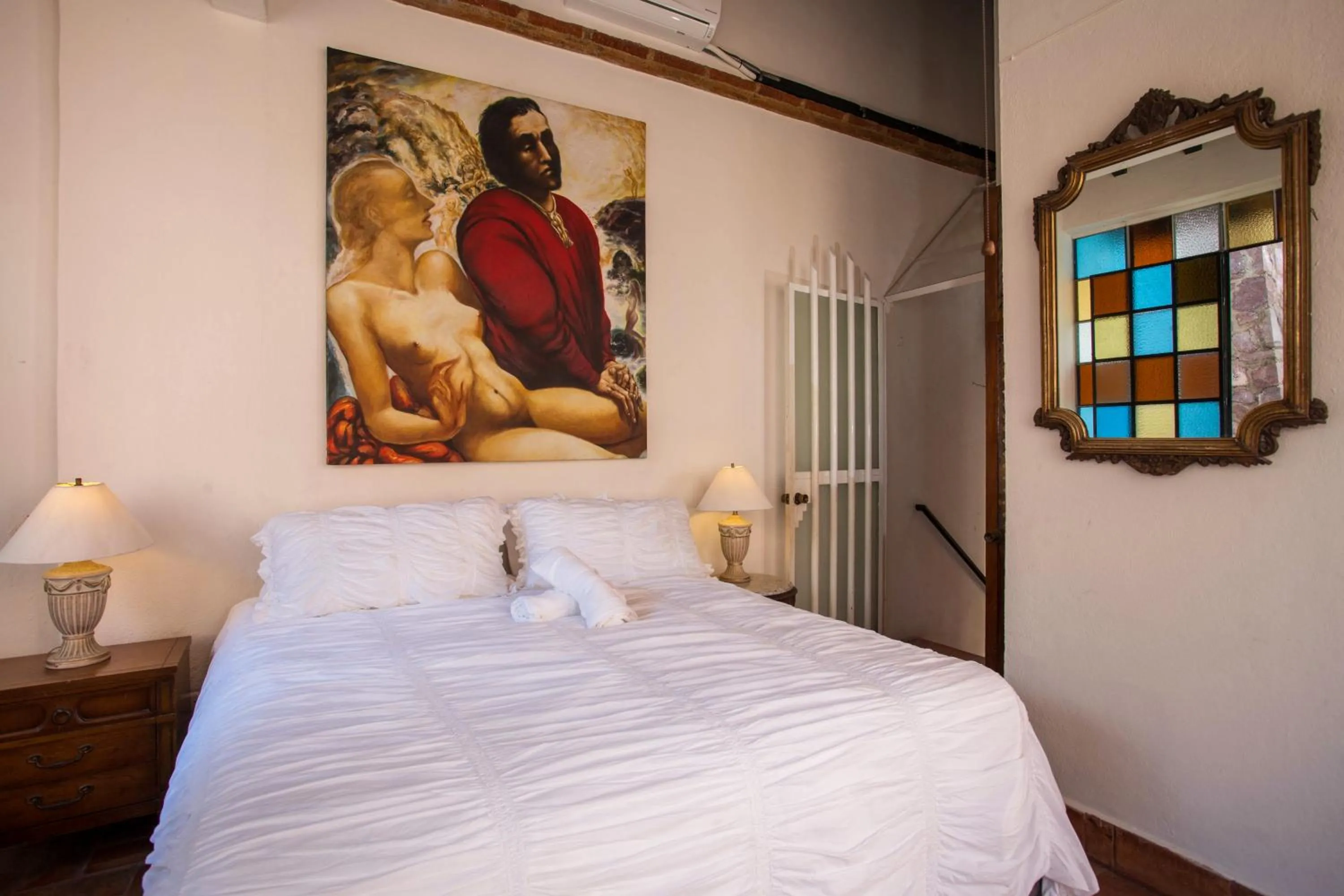 Bed in Garlands Del Rio Riverside Boutique Hotel