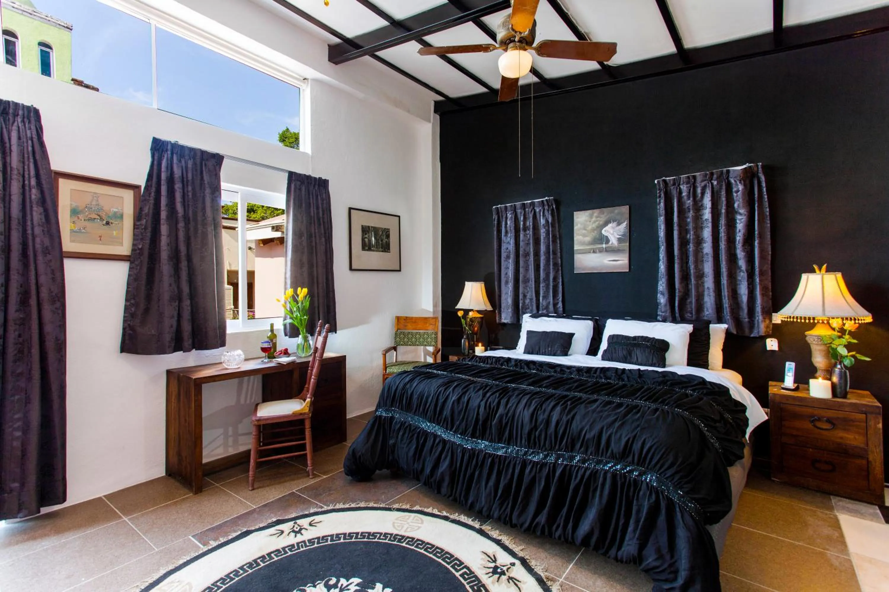 Bed in Garlands Del Rio Riverside Boutique Hotel