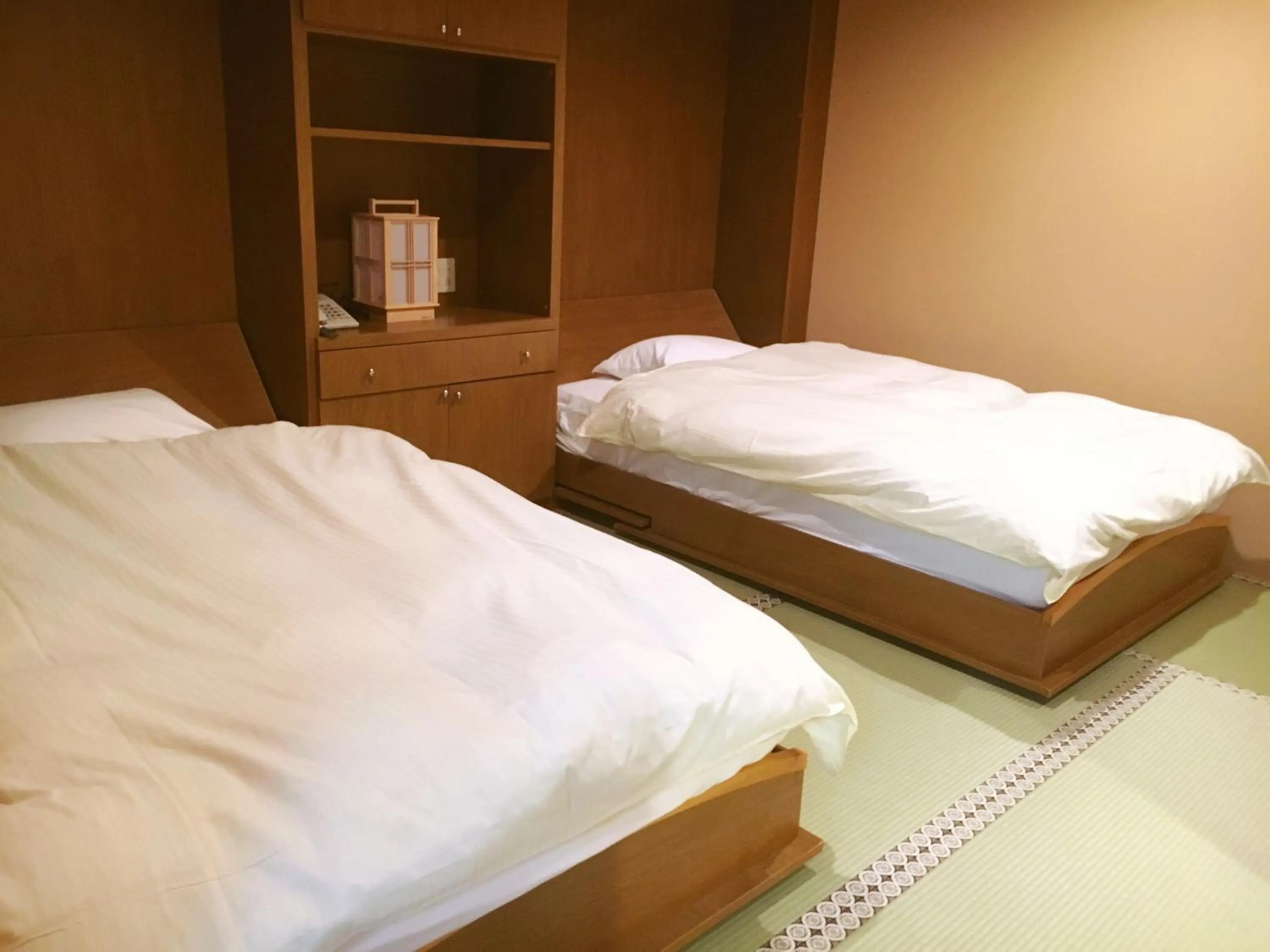 Bed in 高野山 宿坊 総持院 -Koyasan Shukubo Sojiin-
