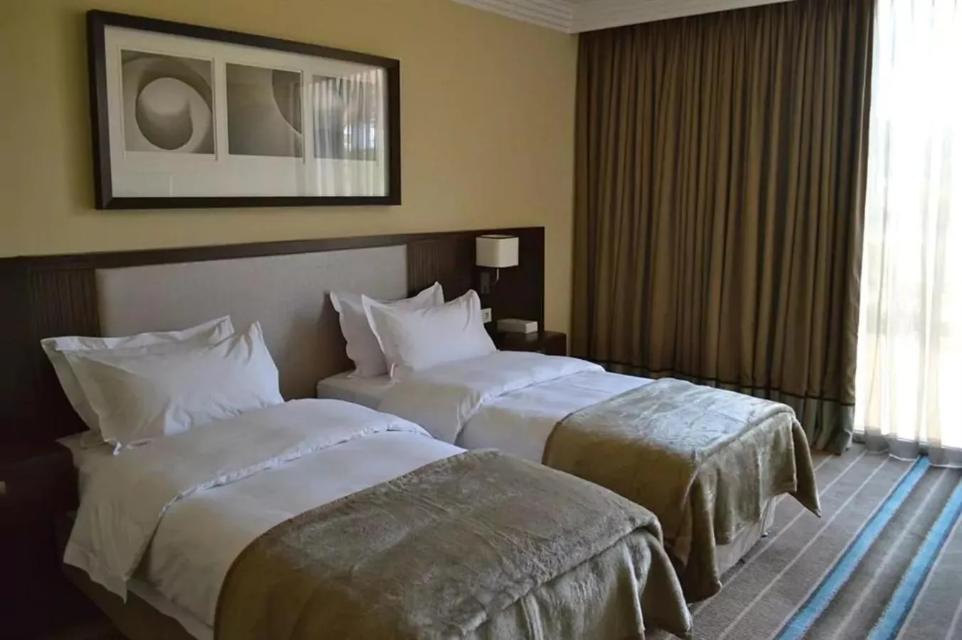 Bedroom, Bed in Pullman Lubumbashi Grand Karavia.