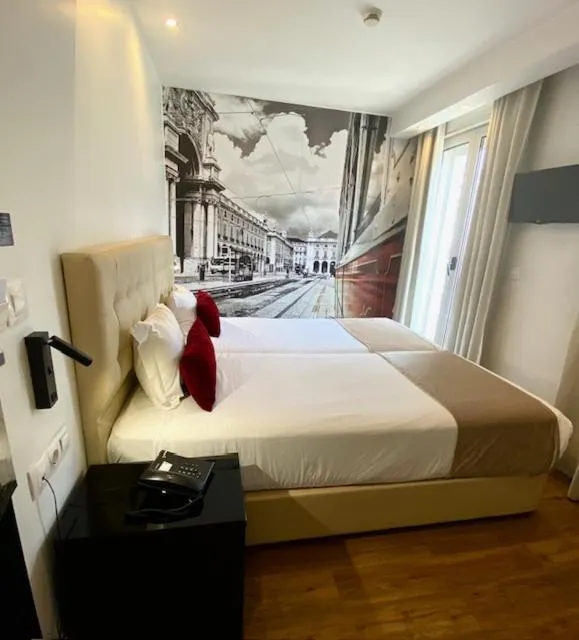 Bed in Lisbon City Apartments & Suites by City Hotels