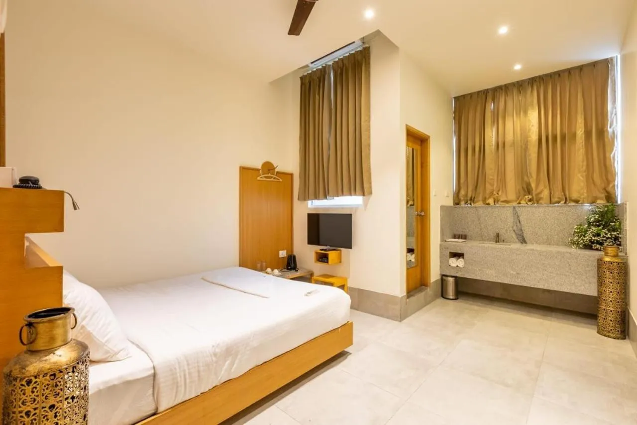 Bed in THE QUARTERS BUSINESS Hotel