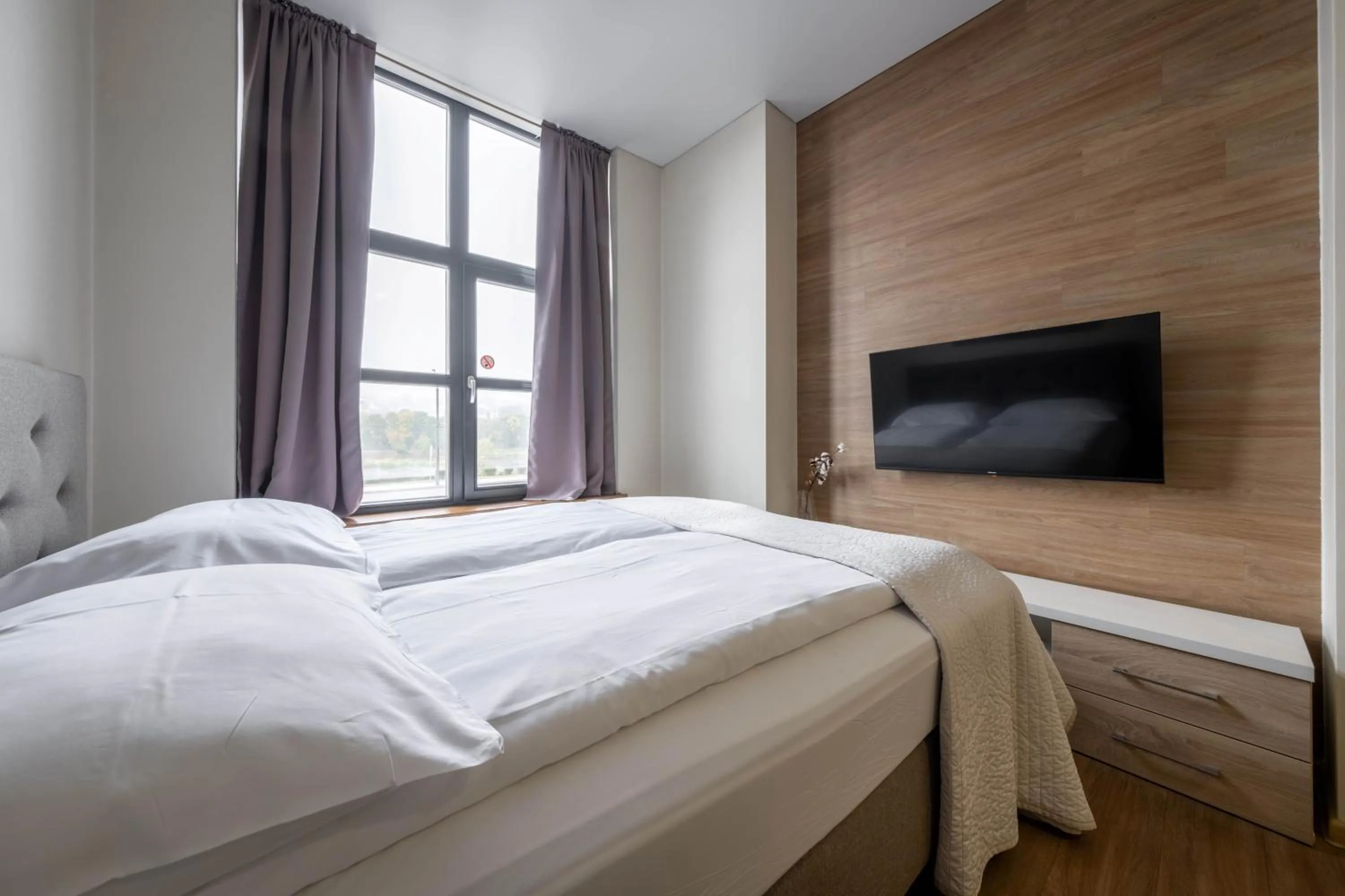 Bed in King Mindaugas Apartments