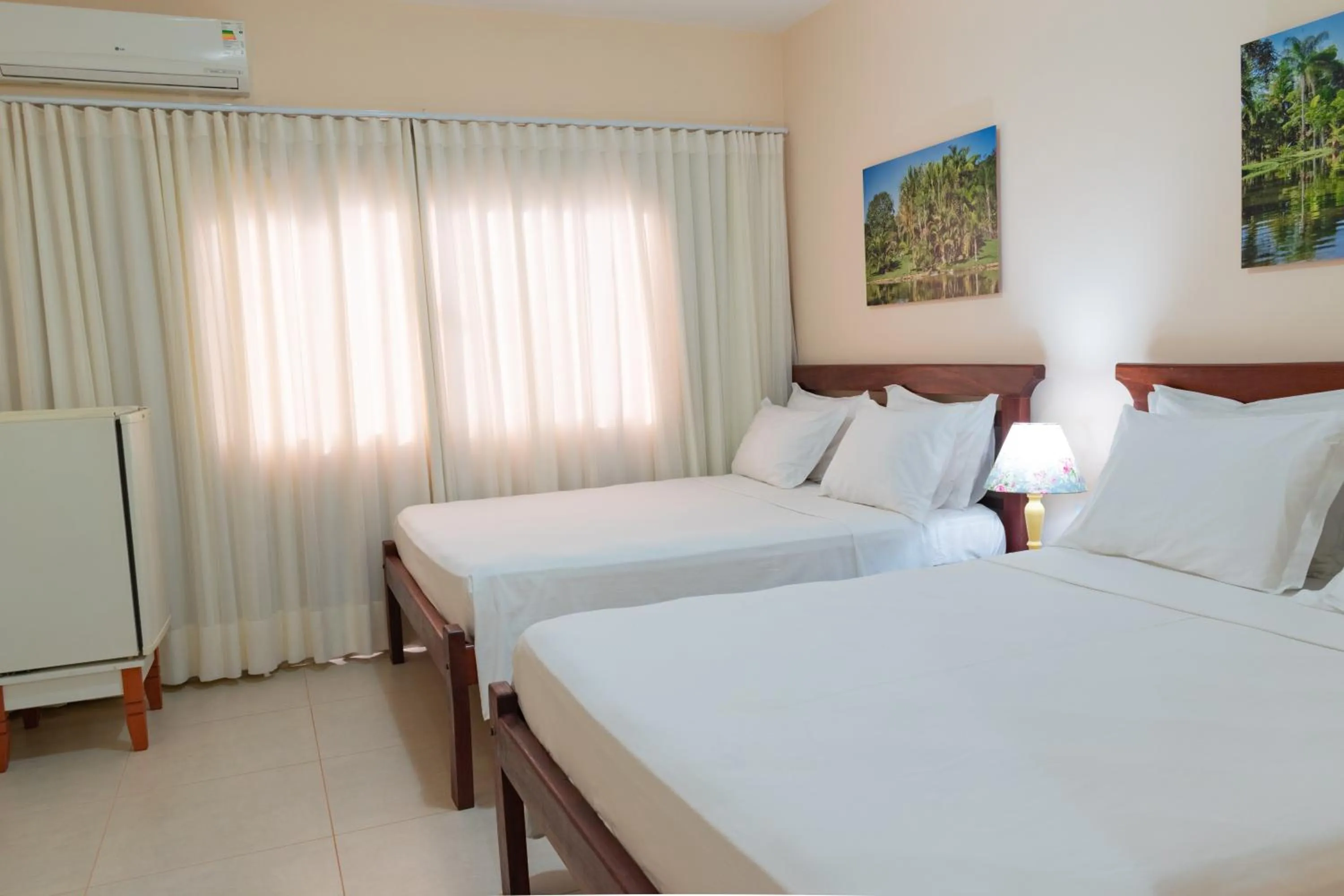 Bed in BellaMinas Pousada