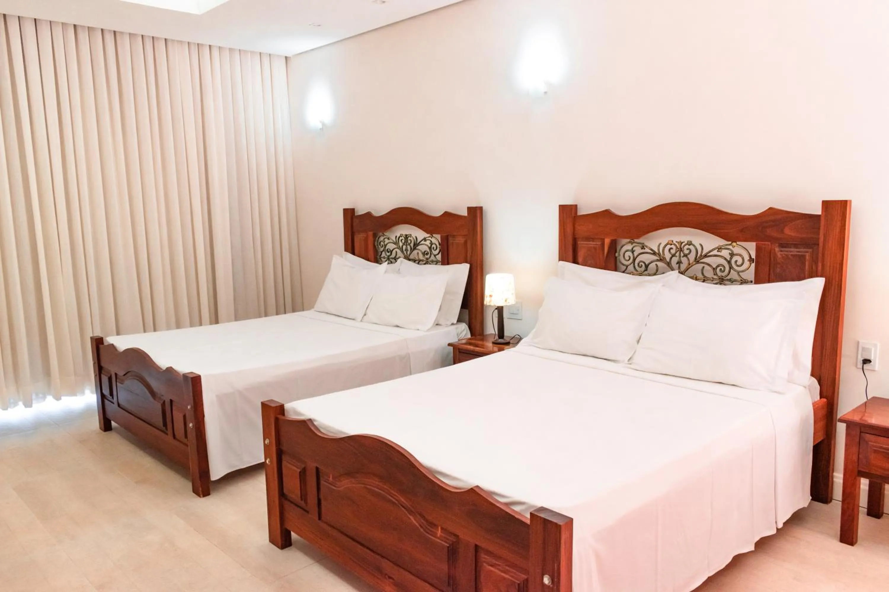 Bed in BellaMinas Pousada