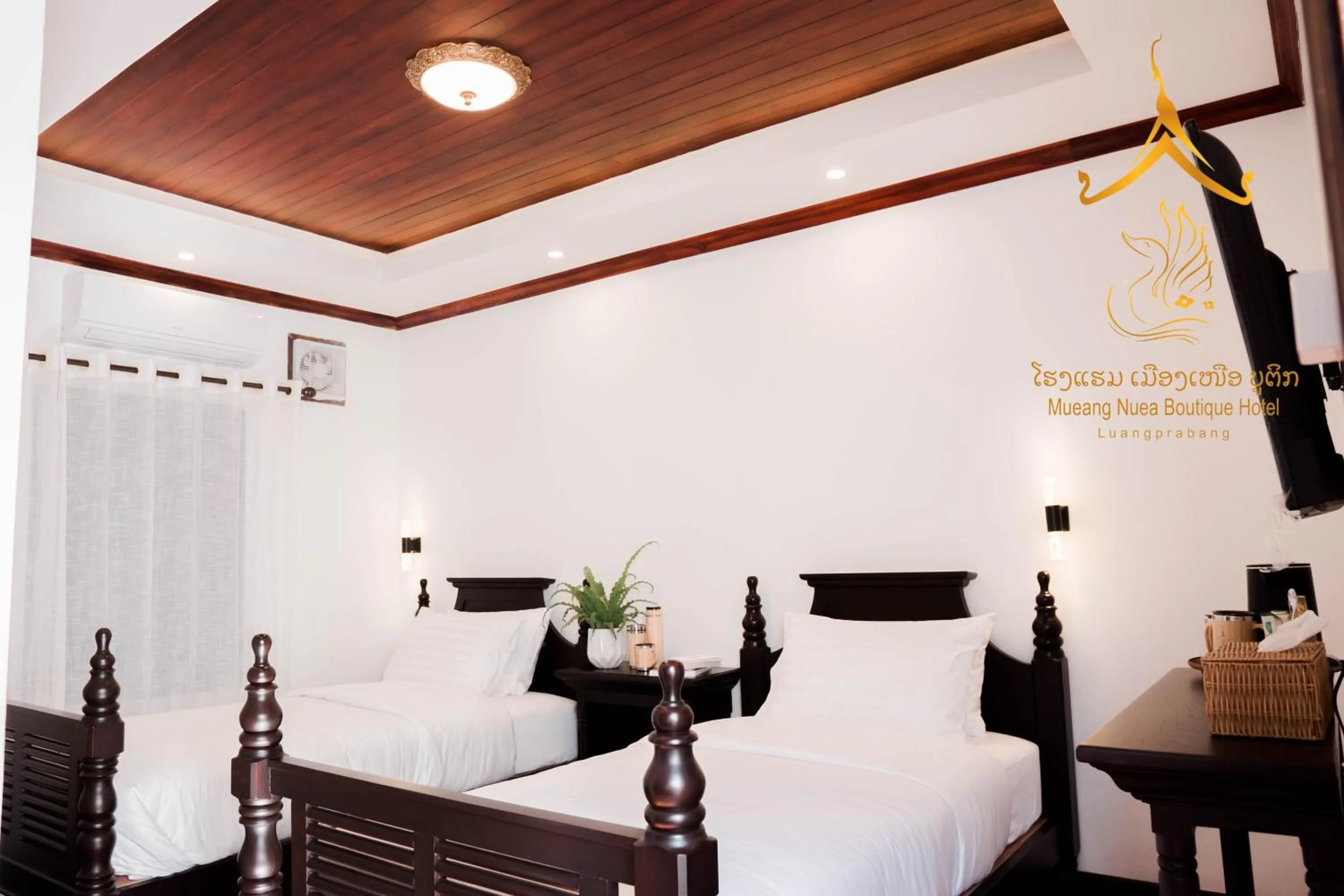 Bed in Mueang Nuea Boutique Hotel