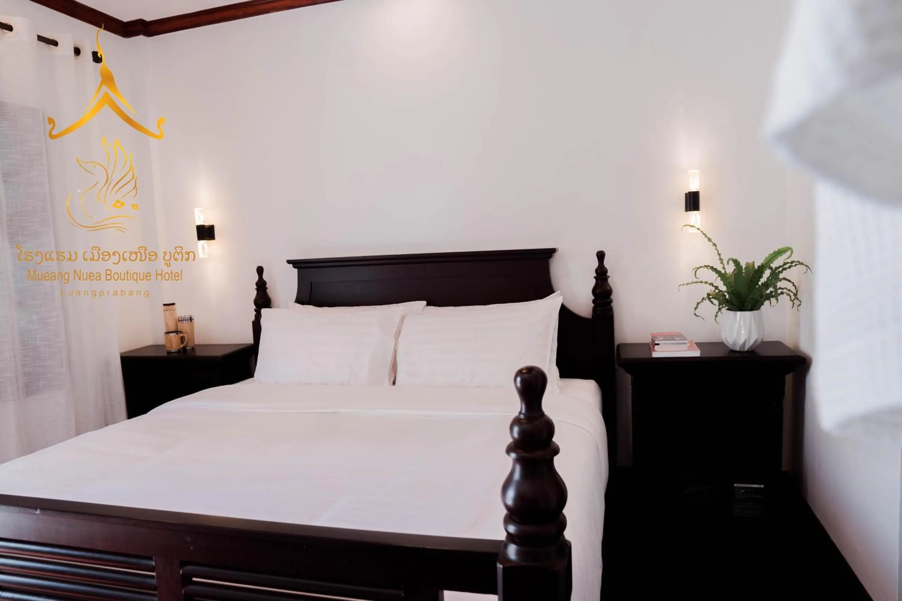 Bed in Mueang Nuea Boutique Hotel