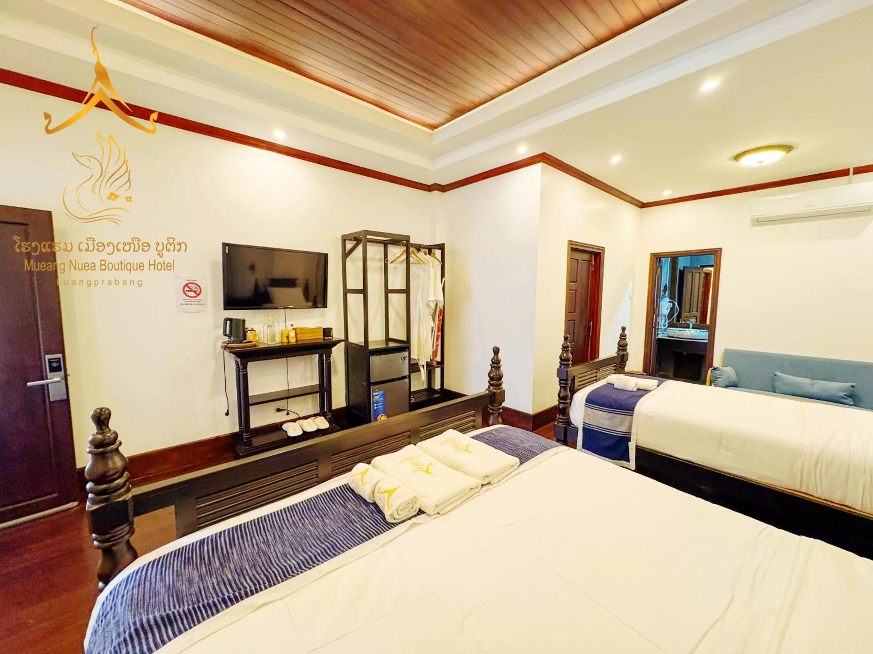 Photo of the whole room, Bed in Mueang Nuea Boutique Hotel