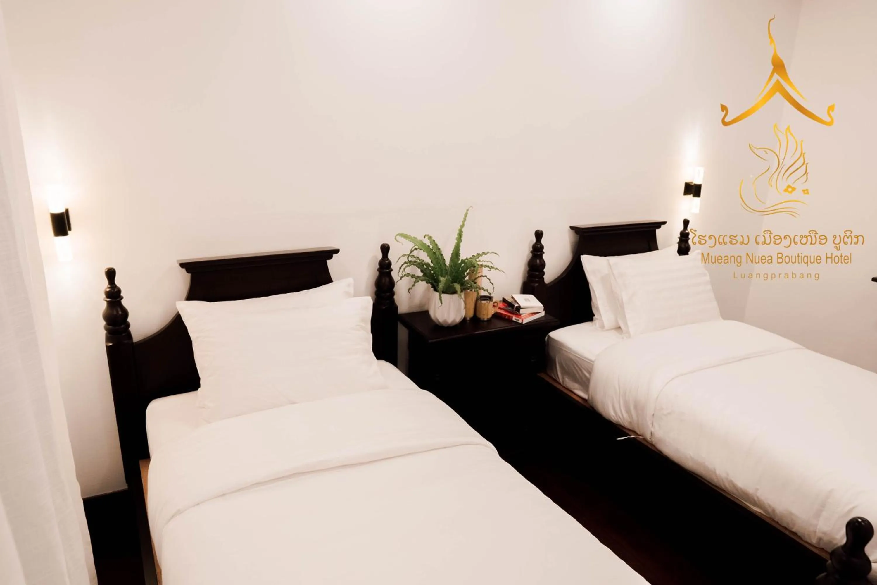 Bed in Mueang Nuea Boutique Hotel