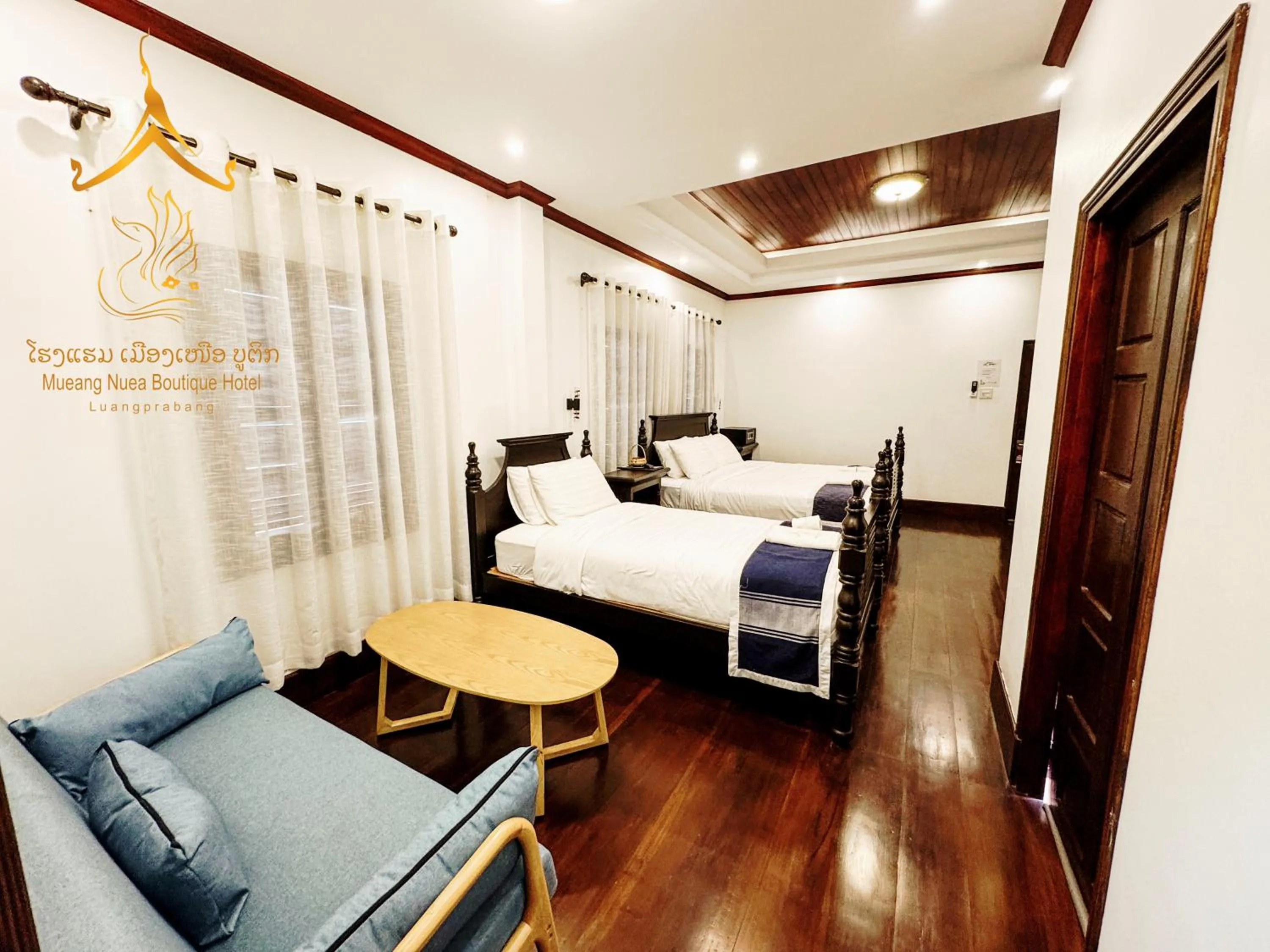 Photo of the whole room, Bed in Mueang Nuea Boutique Hotel