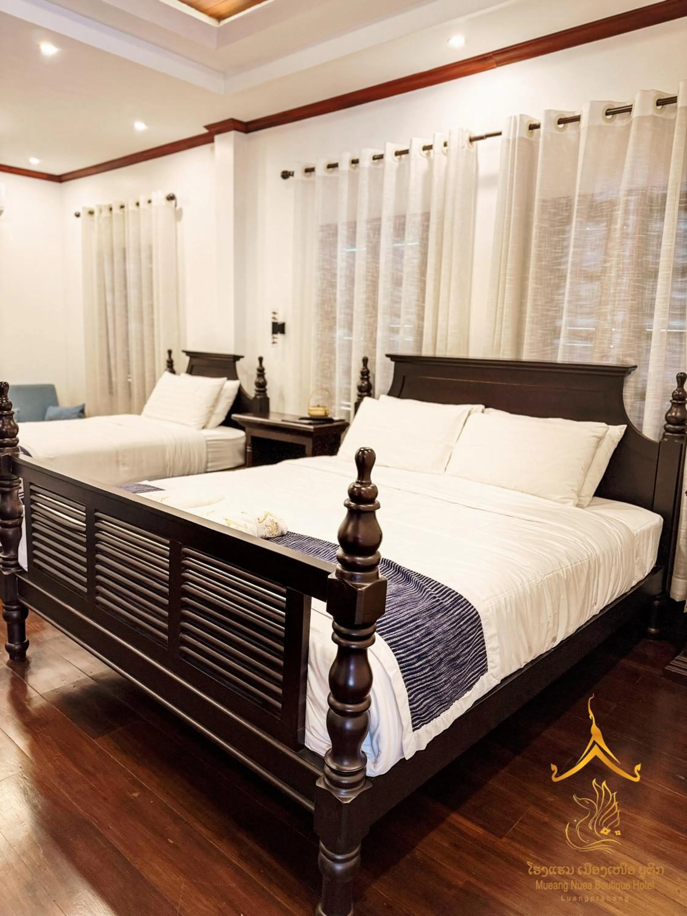 Bed in Mueang Nuea Boutique Hotel