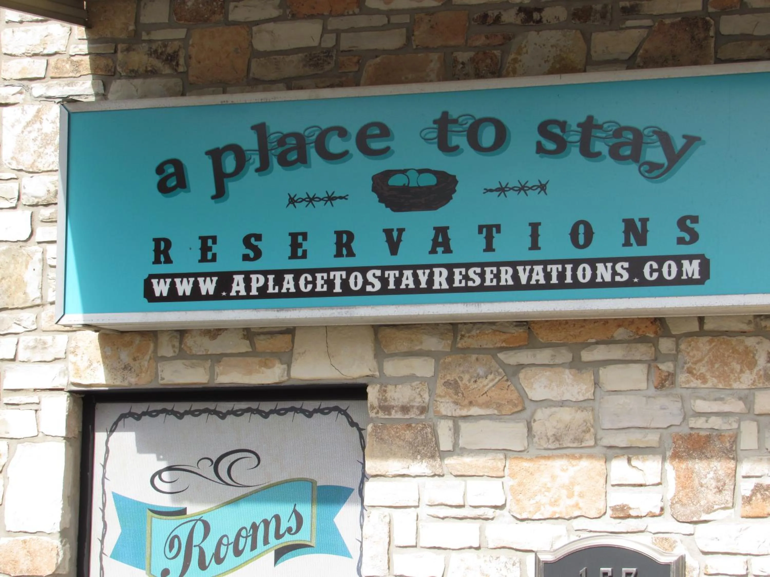 Communal lounge/ TV room in A Place to Stay Rooms