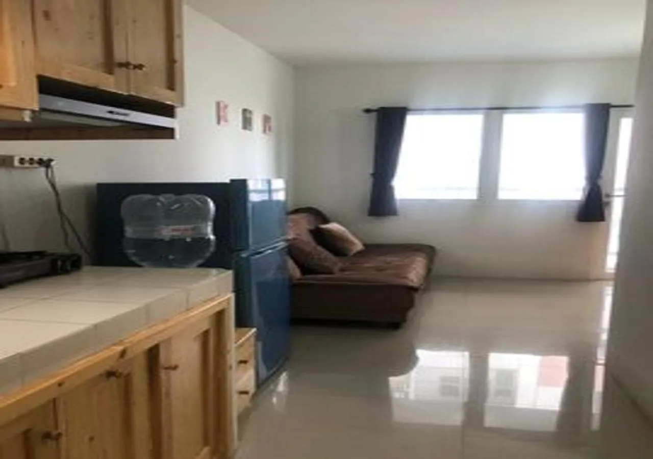 Kitchen or kitchenette in Laguna Room at Apartment Grand Sentraland Karawang