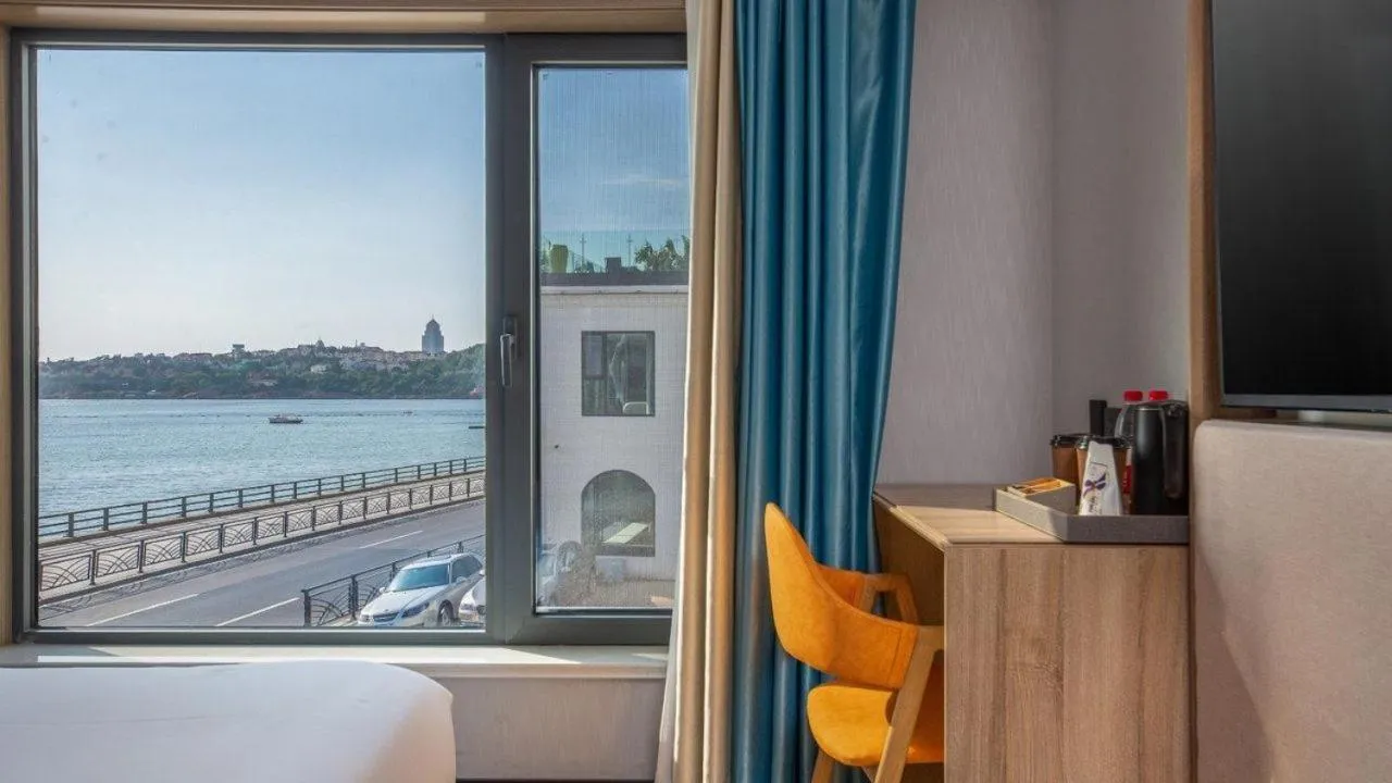 View (from property/room), Bed in Floral Hotel Qingdao Dreamship Seaview Hotel