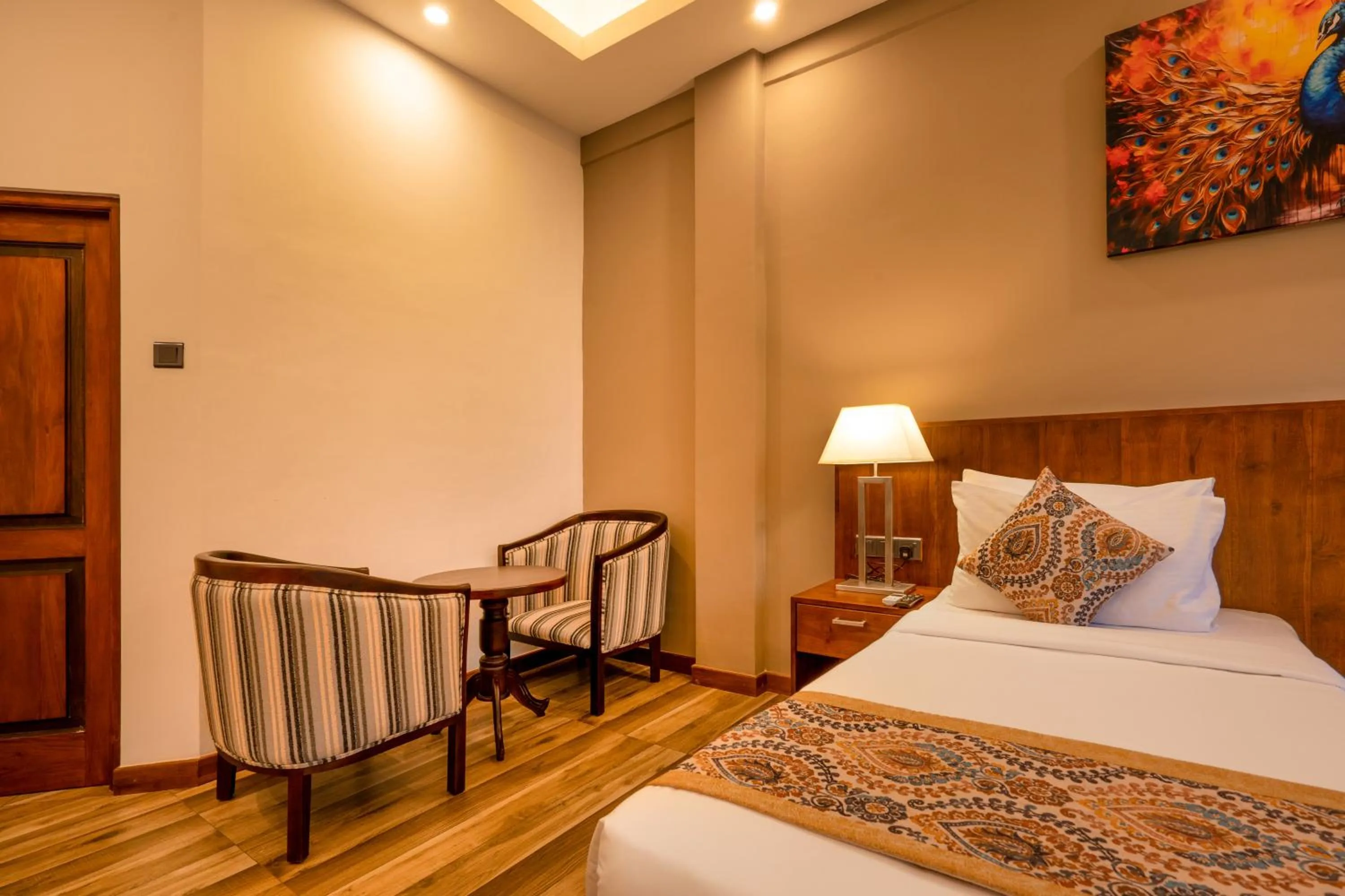 Seating area, Bed in Kandyan Reach Hotel