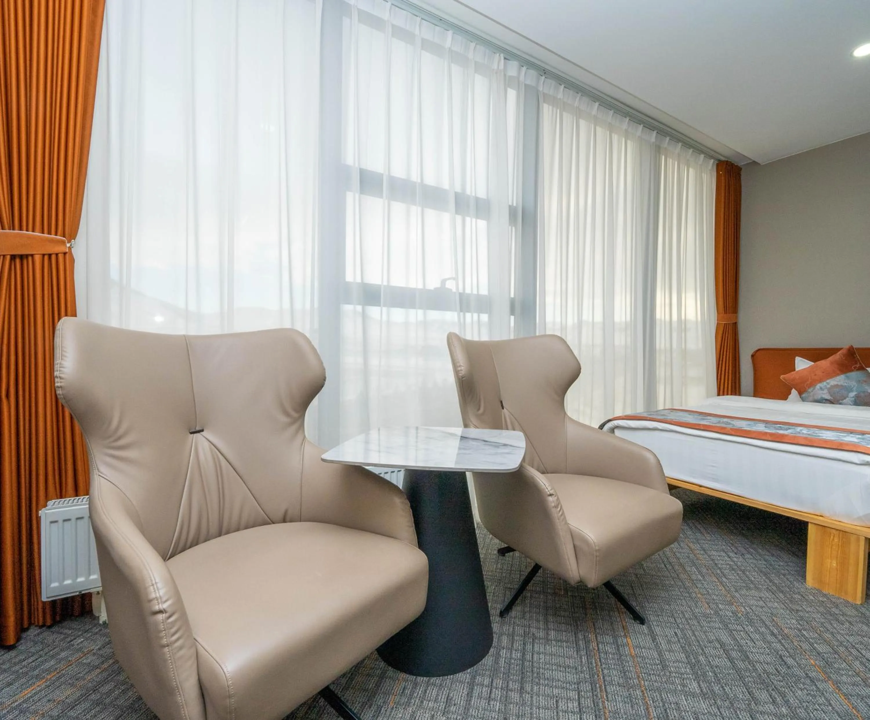 Living room, Bed in Amgun Hotel Ulaanbaatar