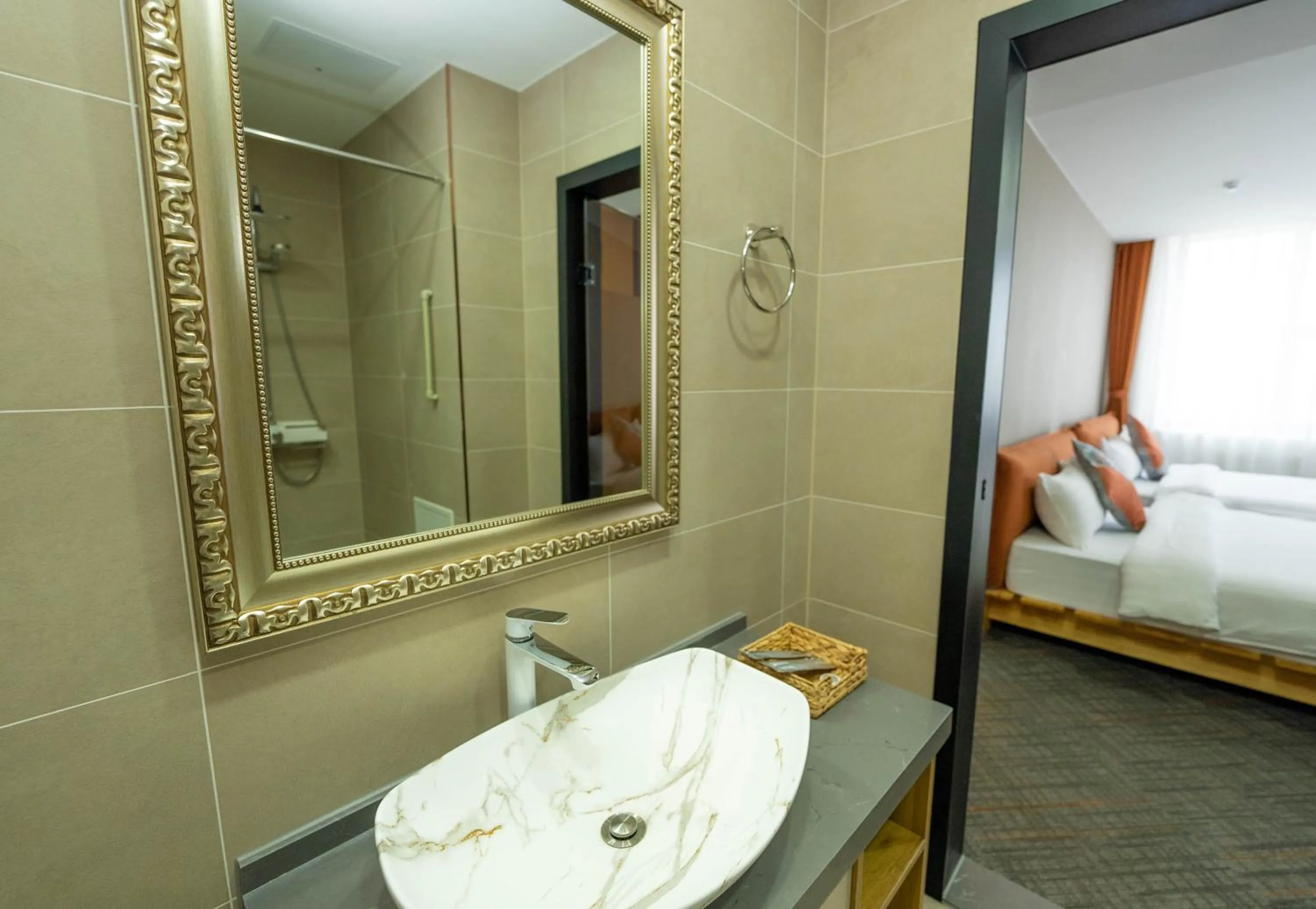 Bathroom, Bed in Amgun Hotel Ulaanbaatar