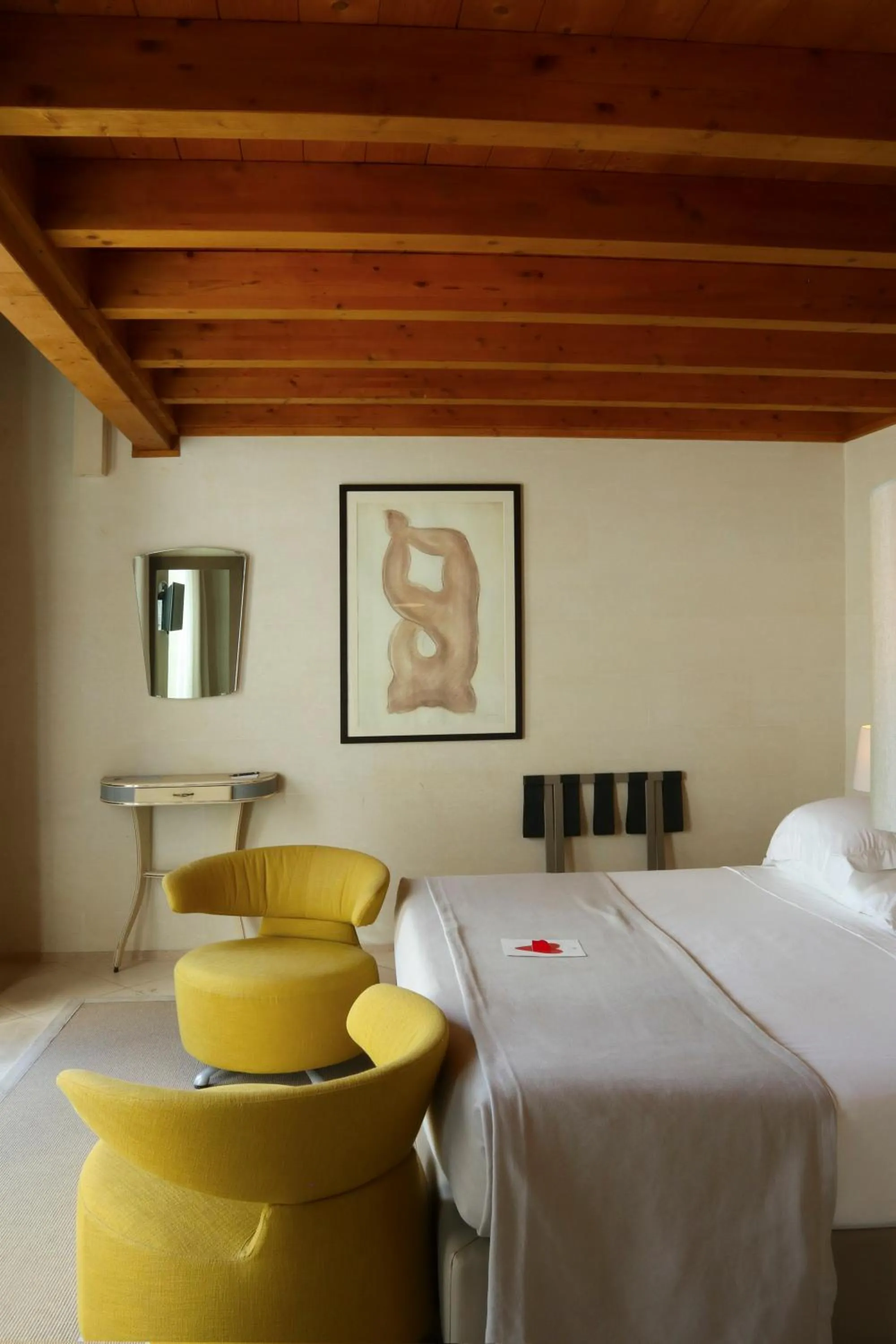 Bed in La Fiermontina Luxury Home Hotel