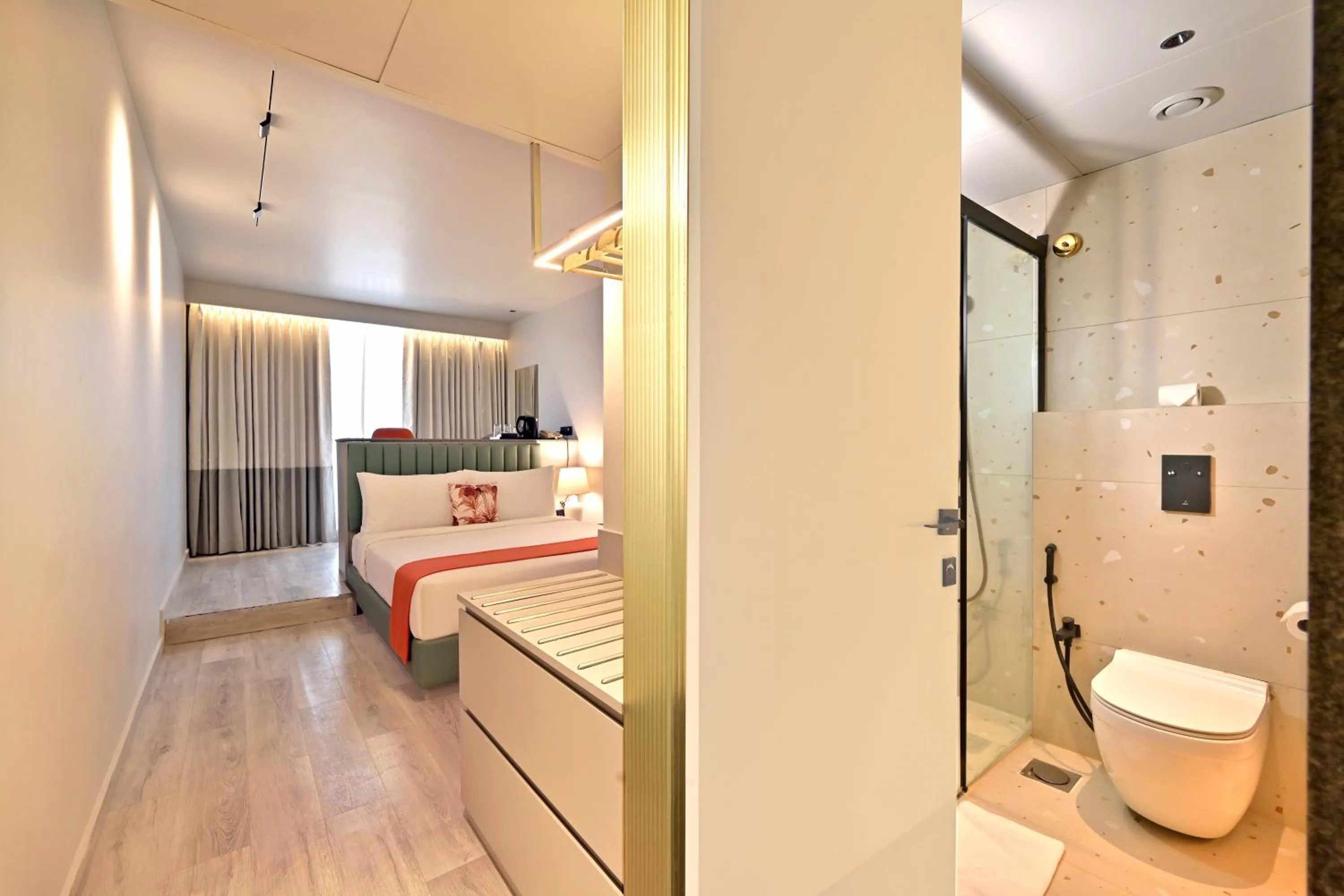 Photo of the whole room, Bed in Ira by Orchid Hyderabad Hitech City Mindspace IT Park