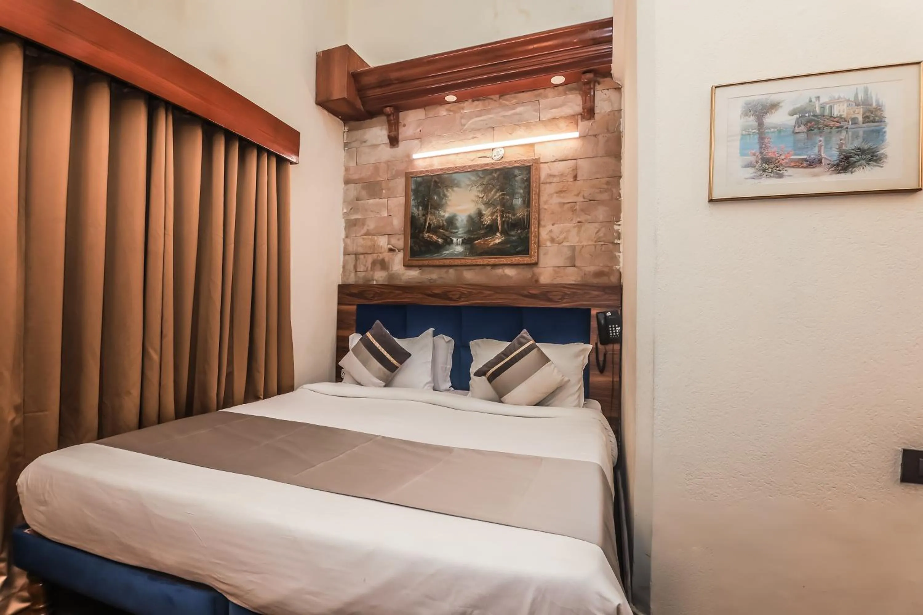 Bed in asar CP Outer Circle by Orion Hotels