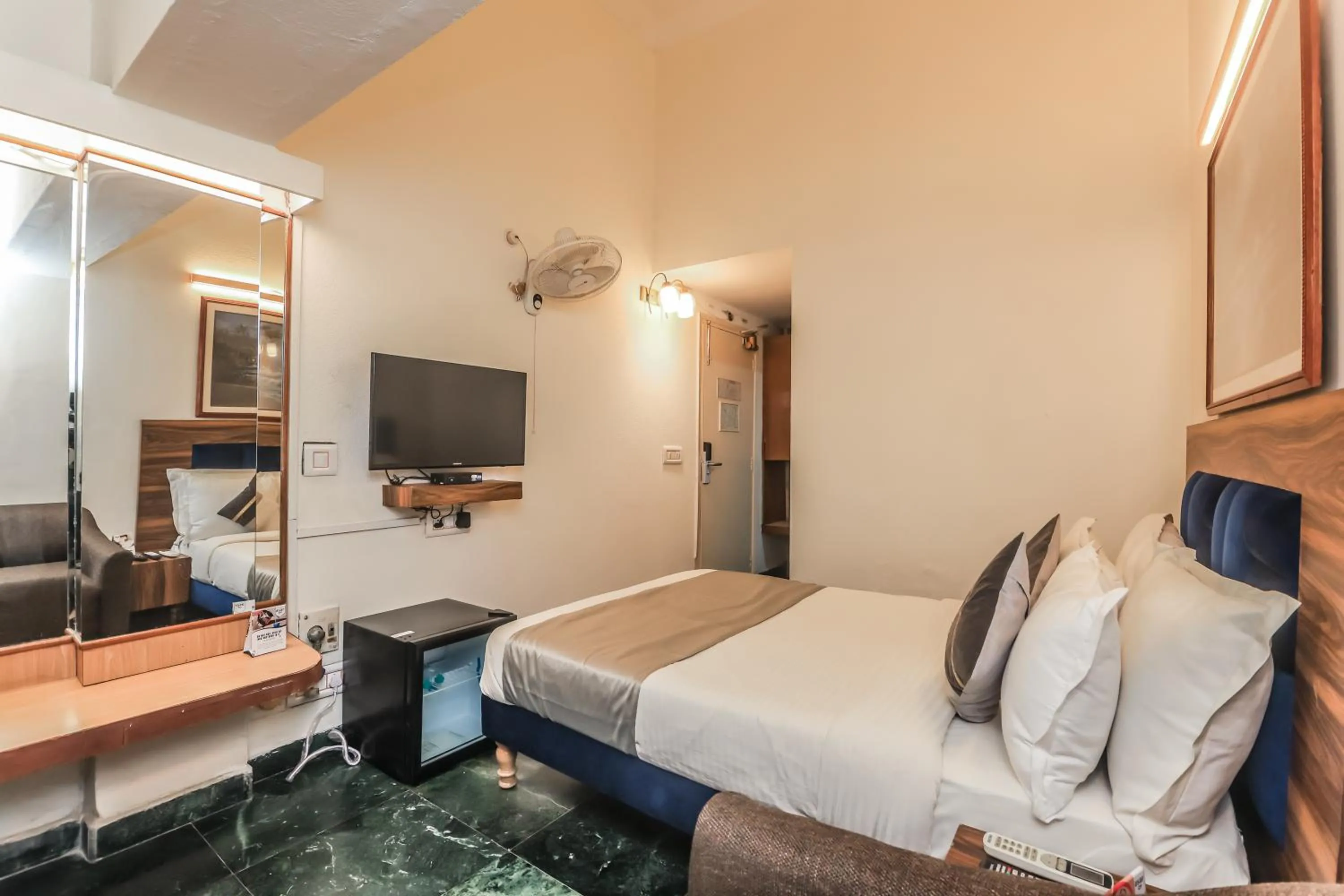 Bed in asar CP Outer Circle by Orion Hotels