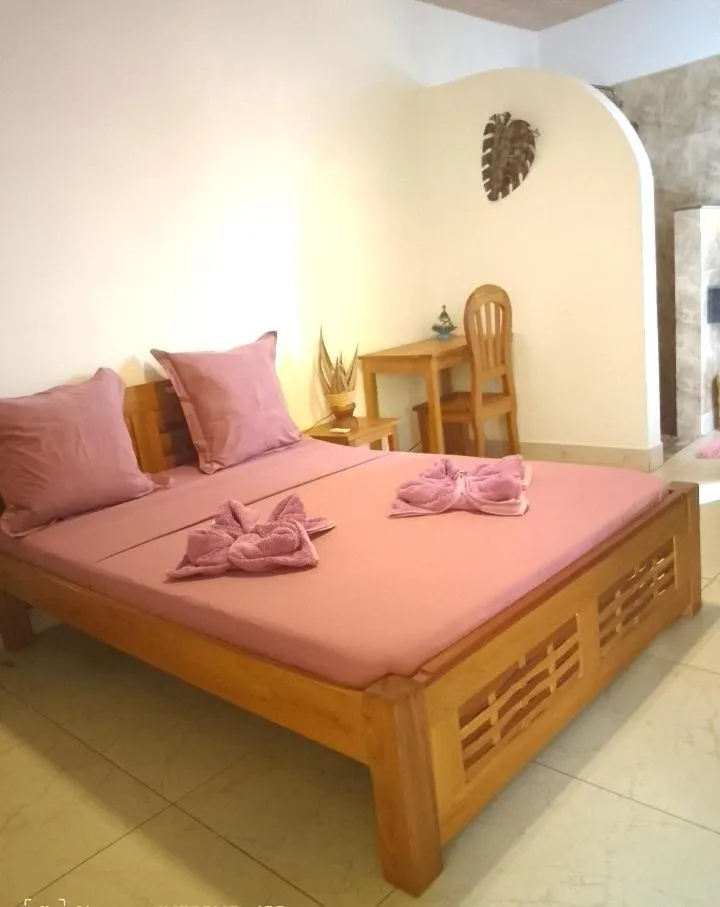 Bed in Tropic Hôtel