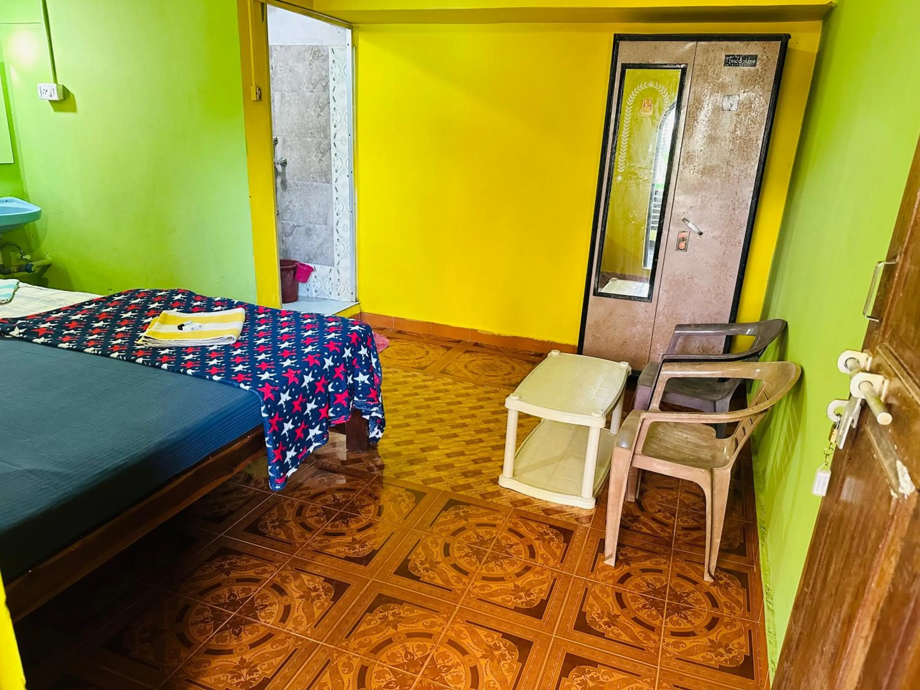 Seating area, Bed in Savitri Guest House