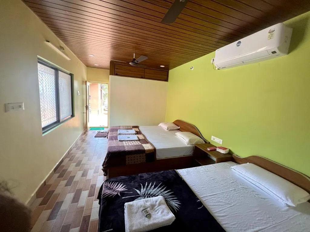 Bed in Leo Comforts river view Resort