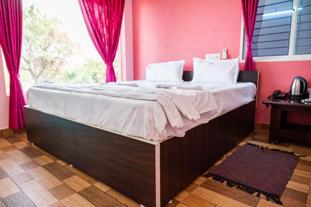 Bed in Leo Comforts river view Resort