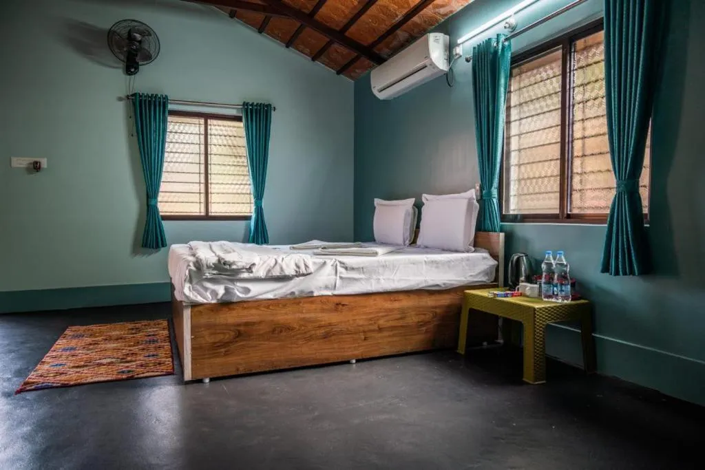 Bed in Leo Comforts river view Resort