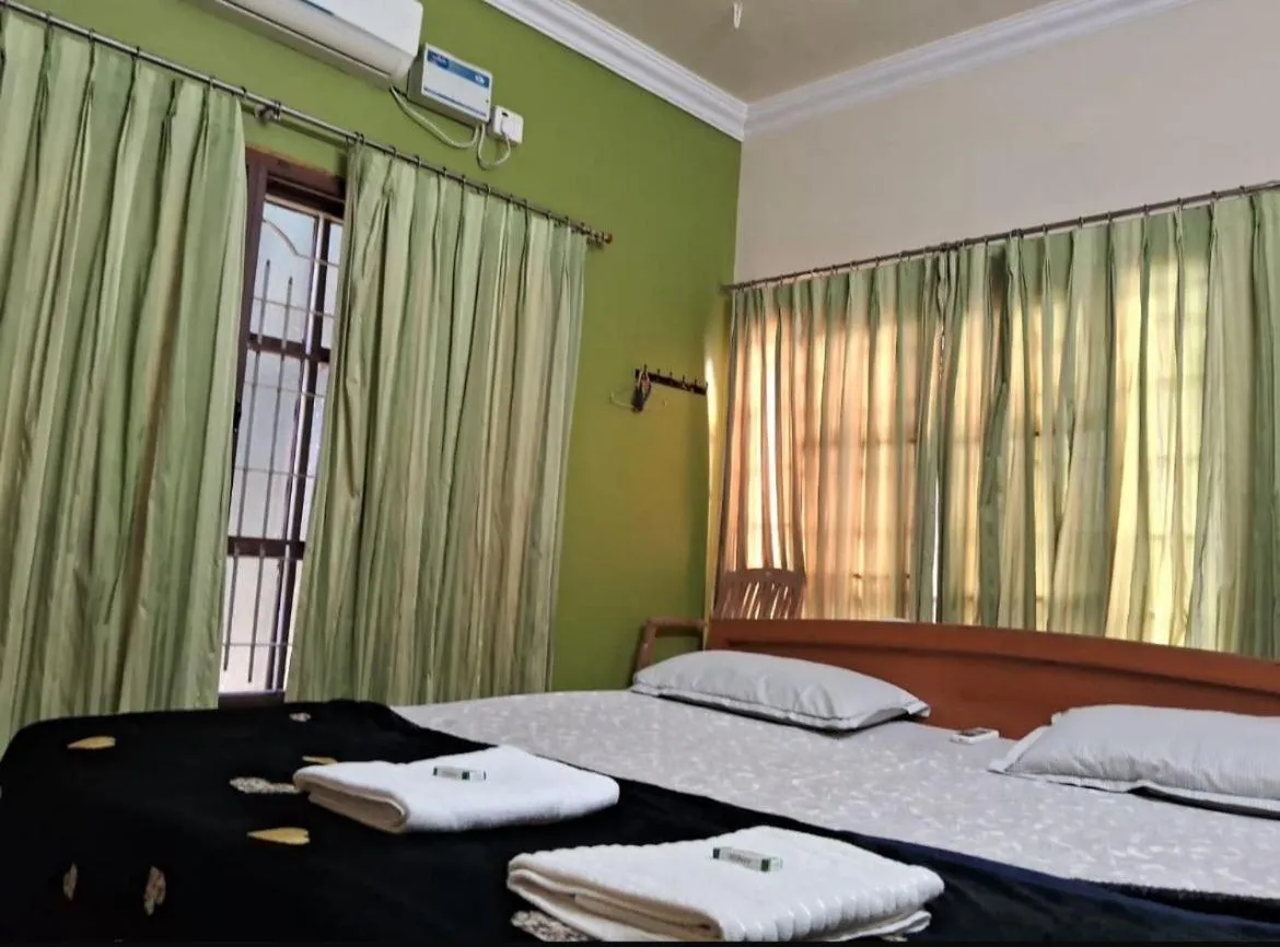 Bed in Leo Comforts river view Resort