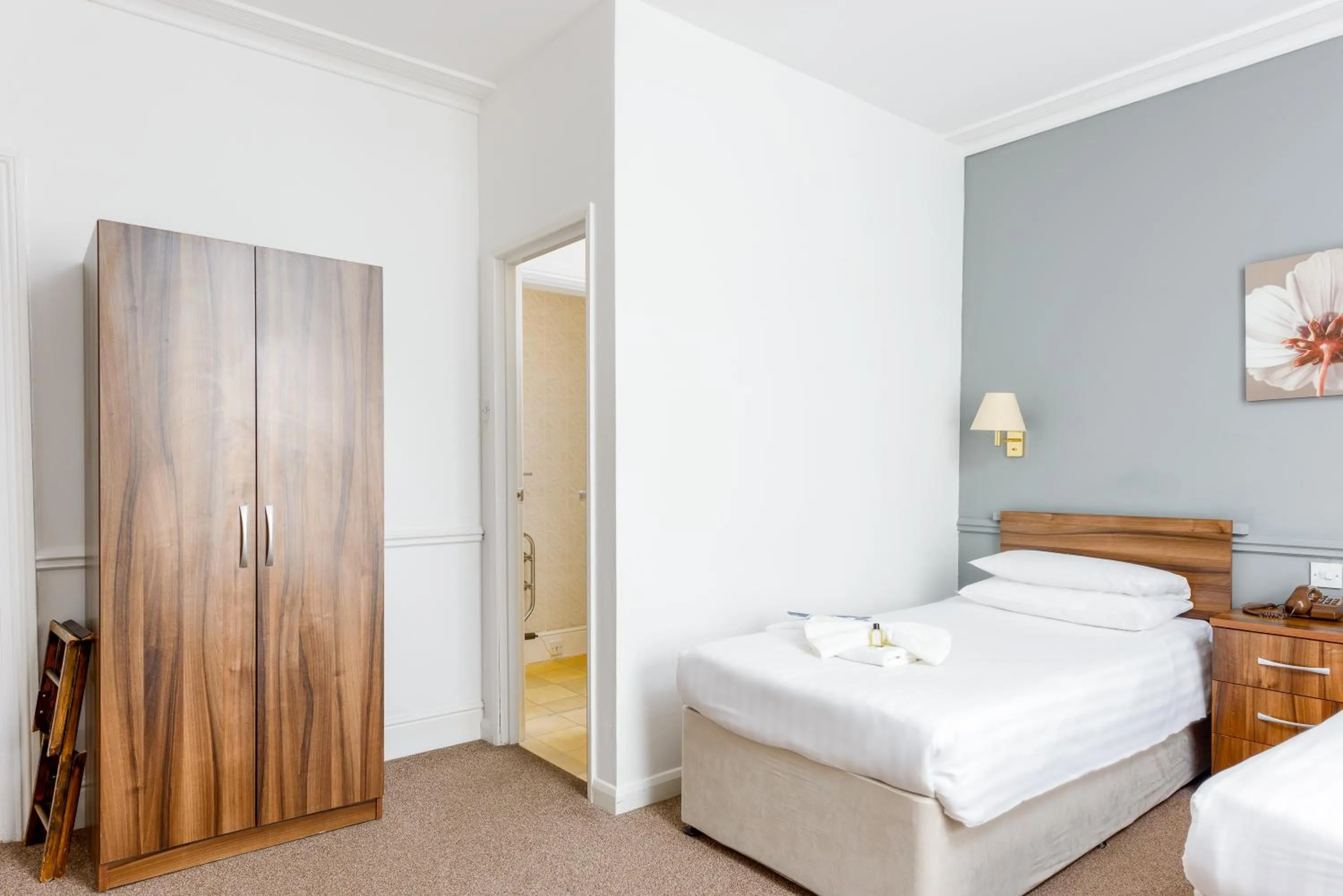 Bed in Abbey Lawn Hotel