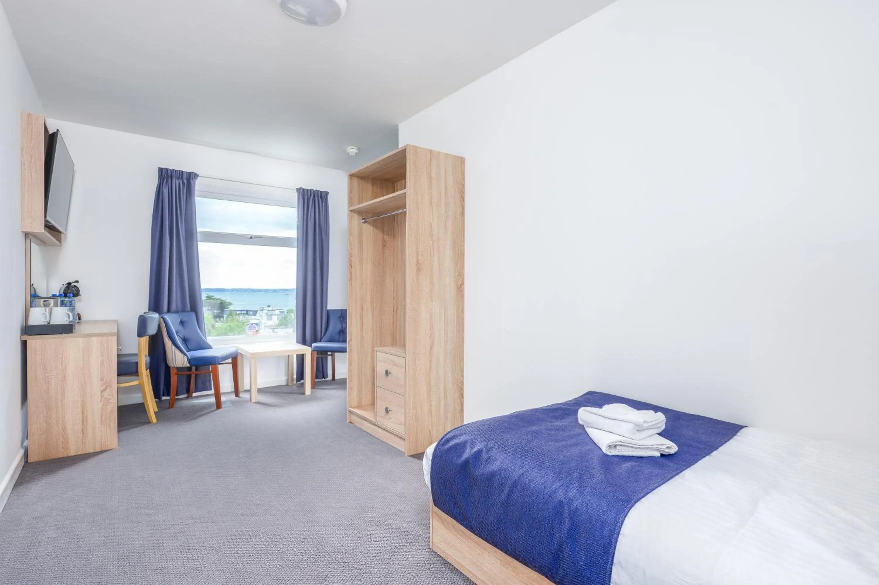 Bed in Abbey Lawn Hotel