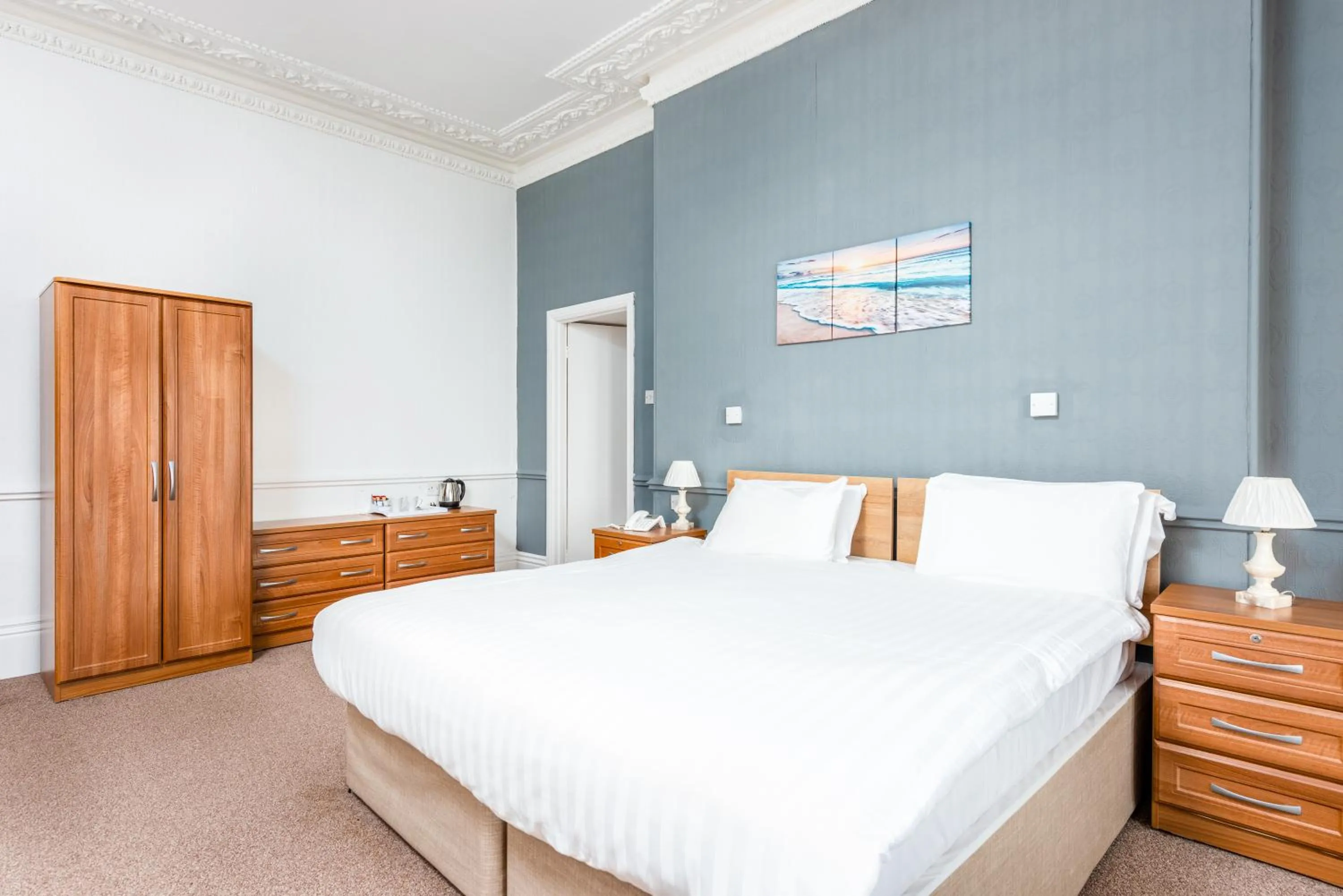 Bed in Abbey Lawn Hotel