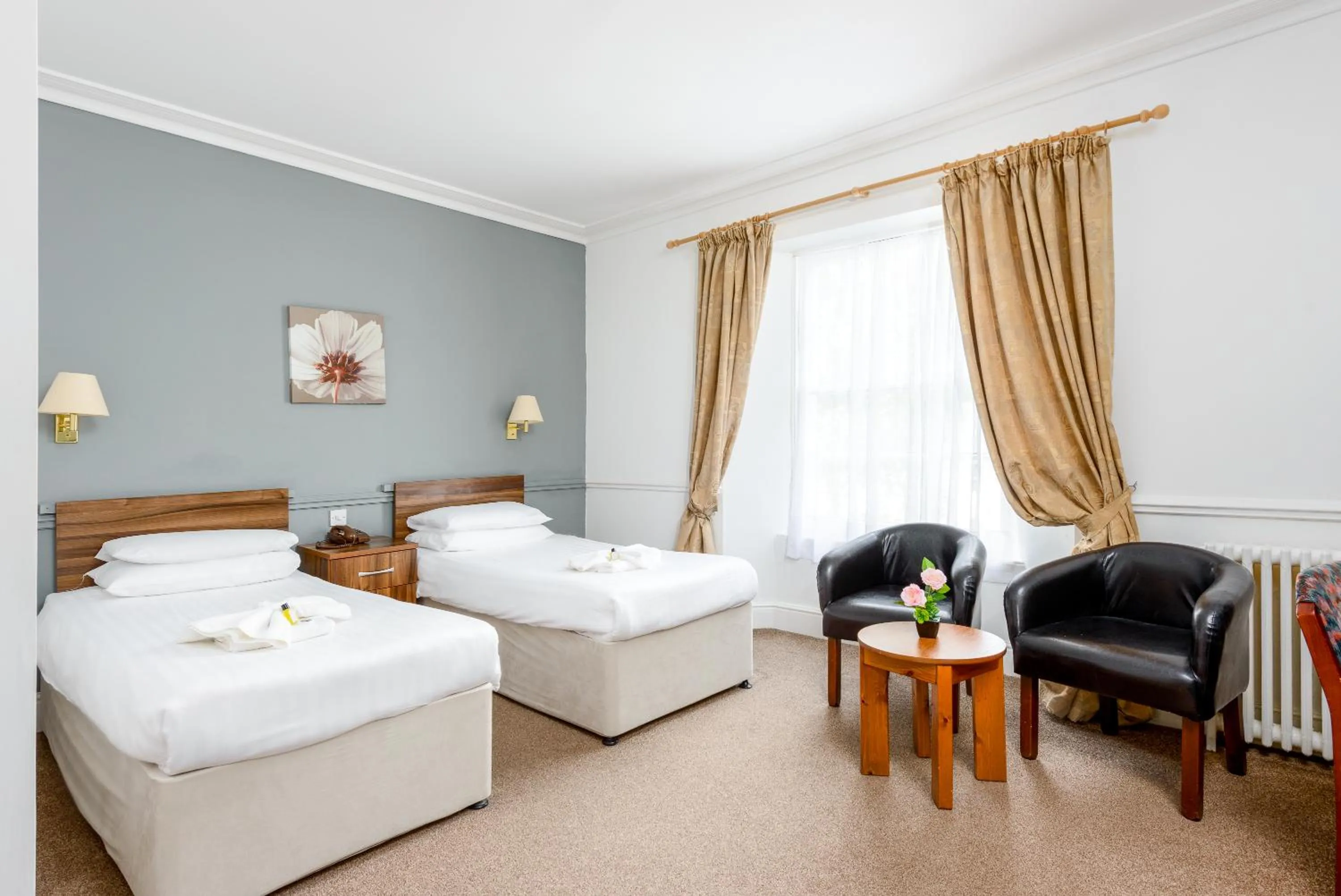 Bed in Abbey Lawn Hotel