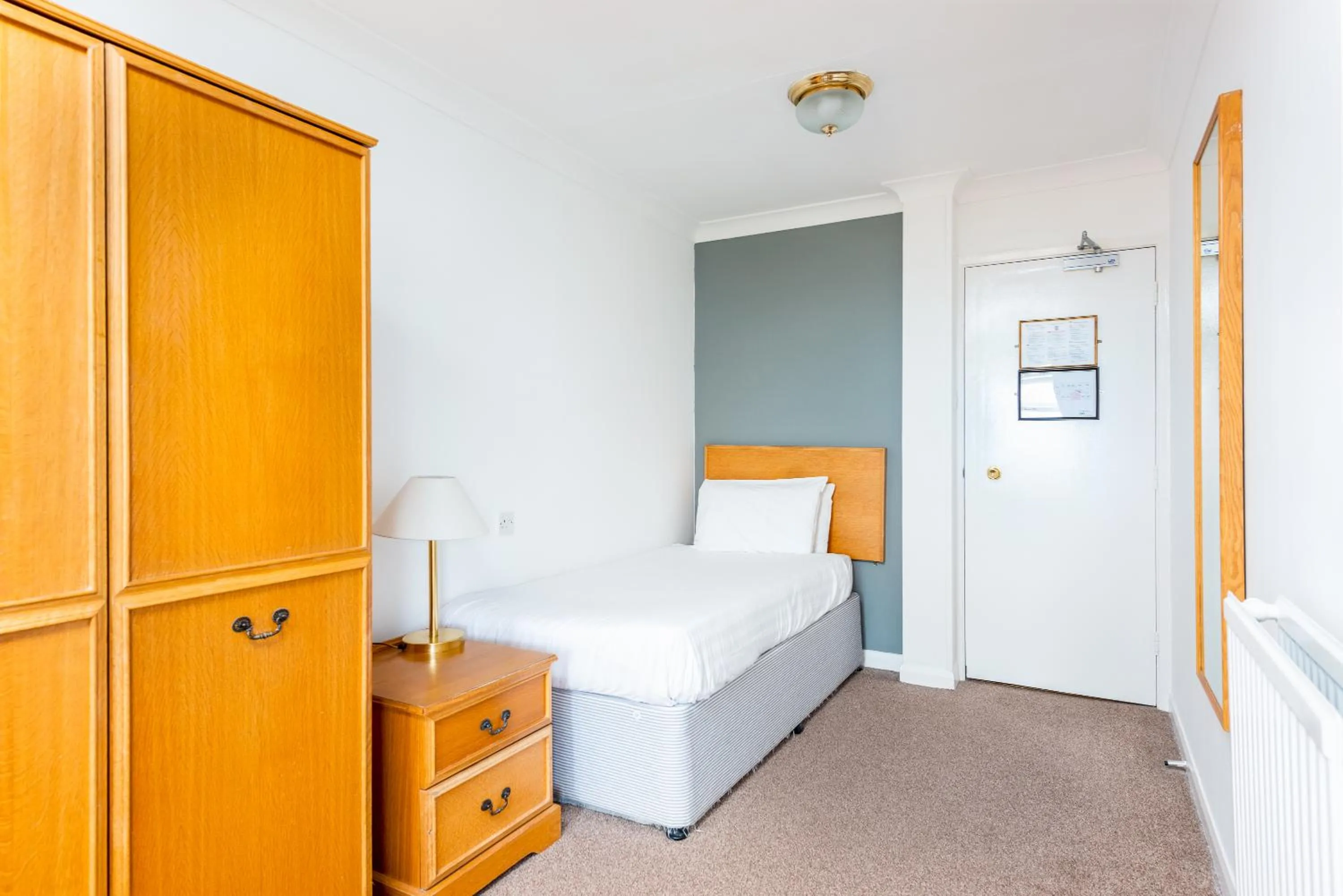 Bed in Abbey Lawn Hotel