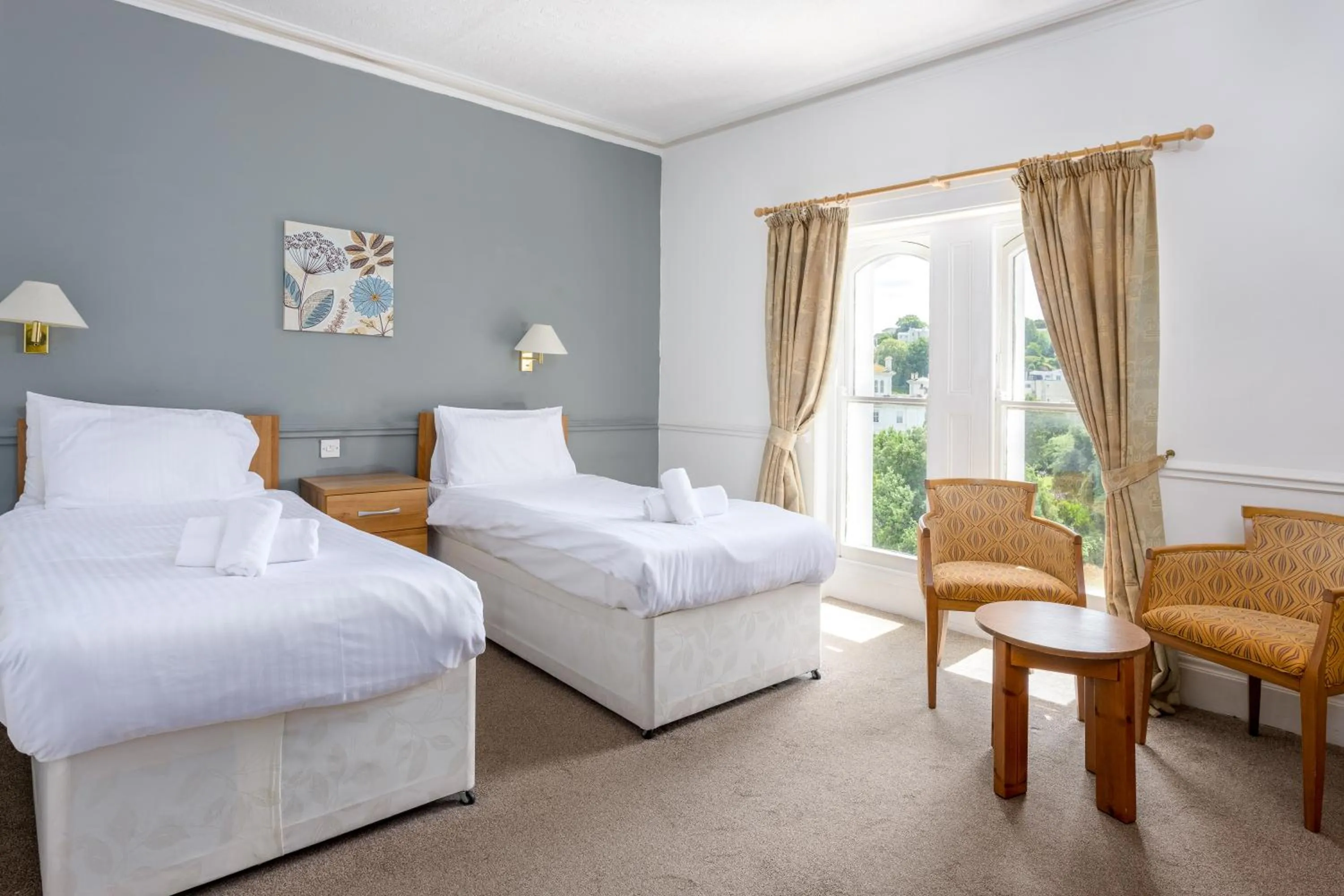 Bed in Abbey Lawn Hotel