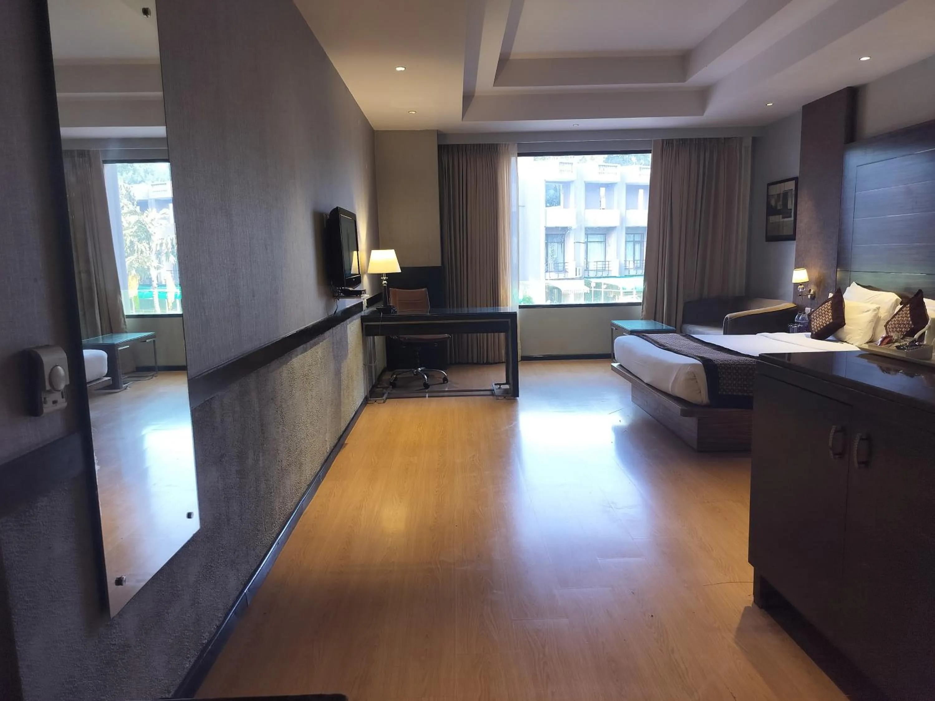 Photo of the whole room, Bed in Stellar Resorts By Bel-La Monde, Rajokri, Near IGI Airport, Delhi