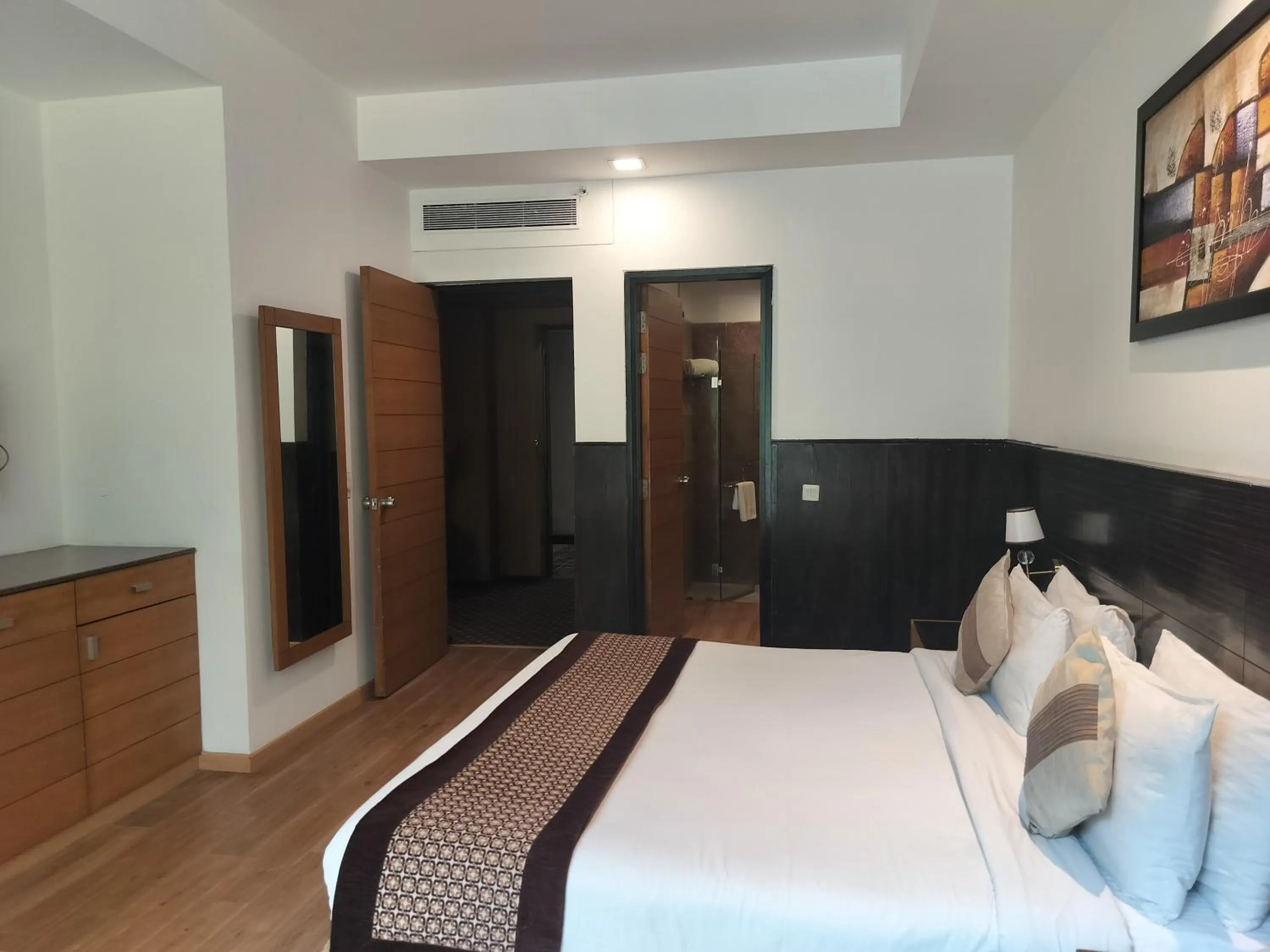 Photo of the whole room, Bed in Stellar Resorts By Bel-La Monde, Rajokri, Near IGI Airport, Delhi