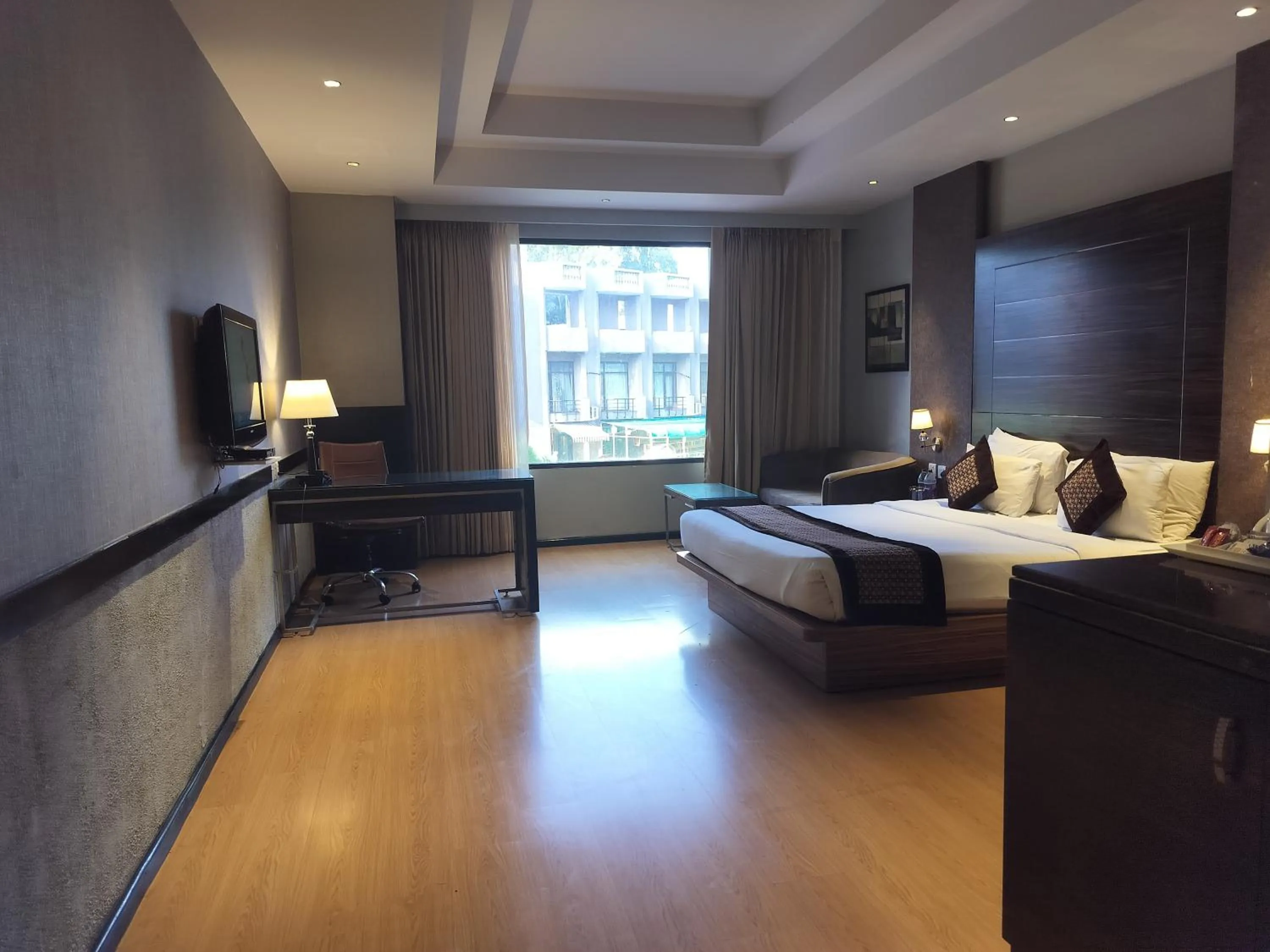 Photo of the whole room, Bed in Stellar Resorts By Bel-La Monde, Rajokri, Near IGI Airport, Delhi