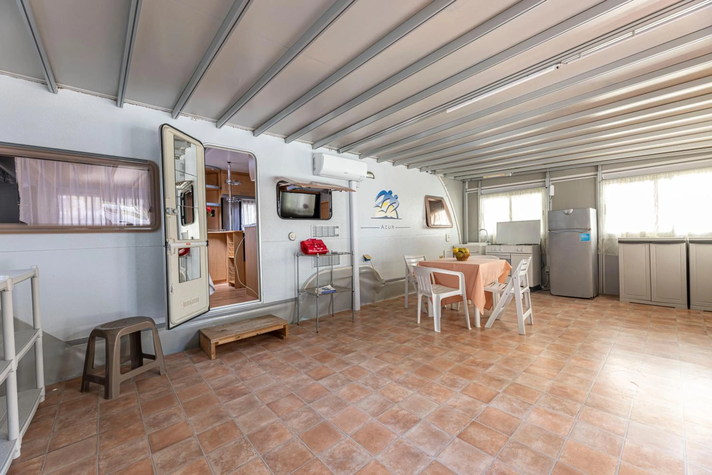 Kitchen or kitchenette in Camping Village Le Calanchiole