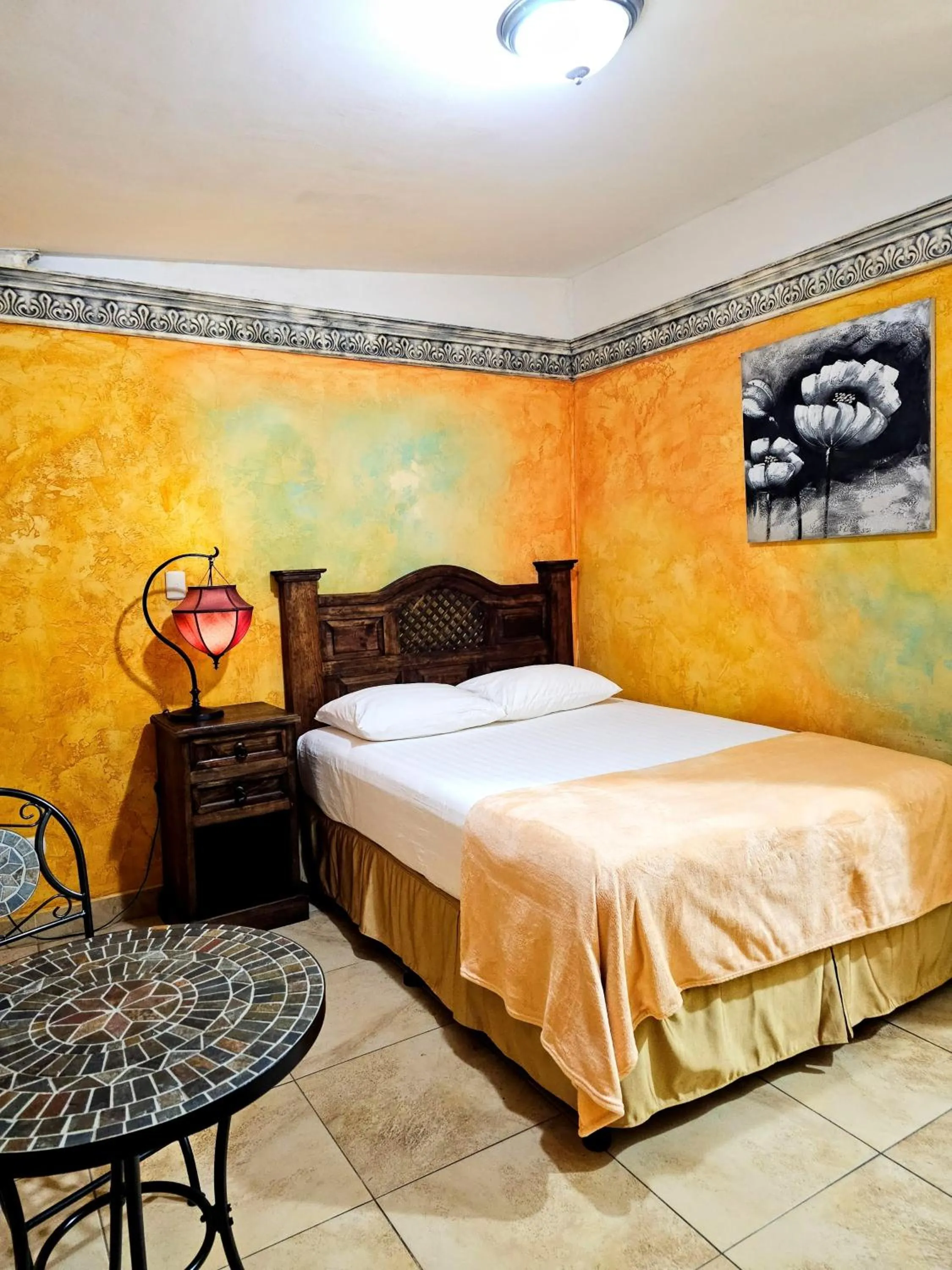 Bed in Antigua Inn Hotel