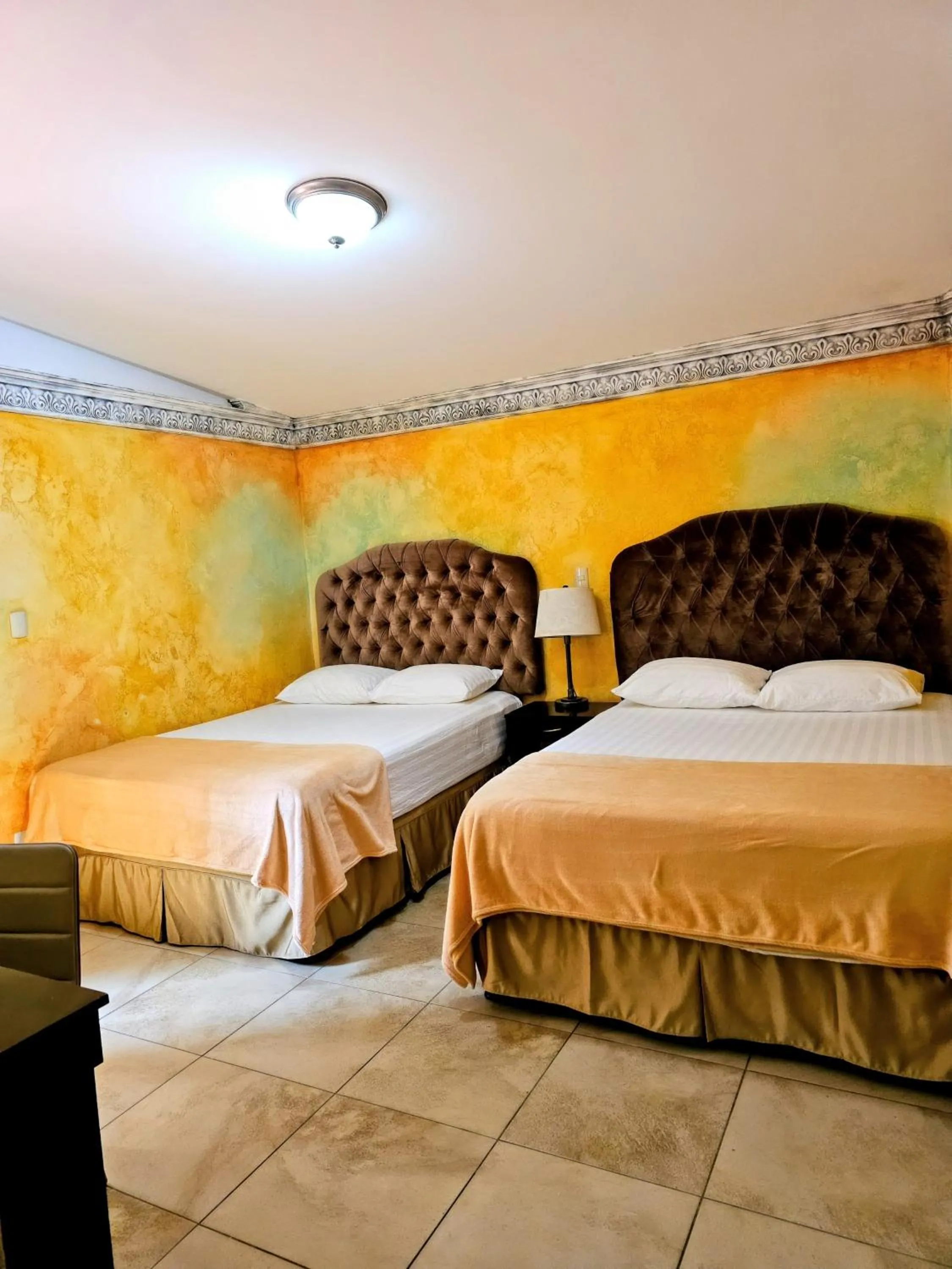 Bed in Antigua Inn Hotel