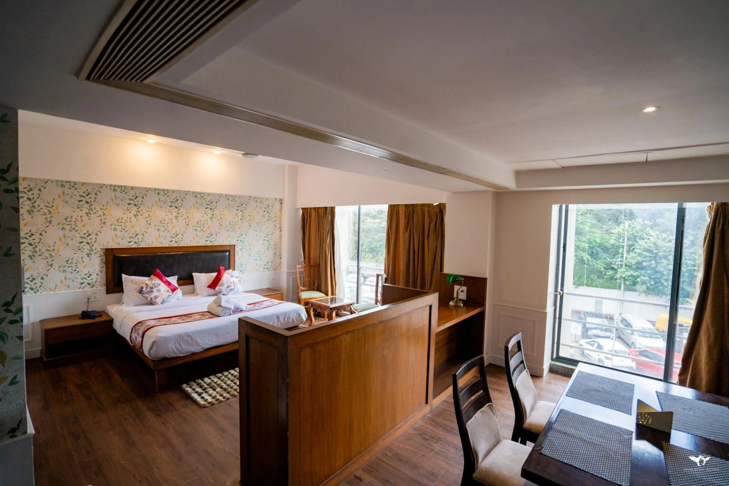 Seating area, Bed in Krishna Inn - Royal Hotels