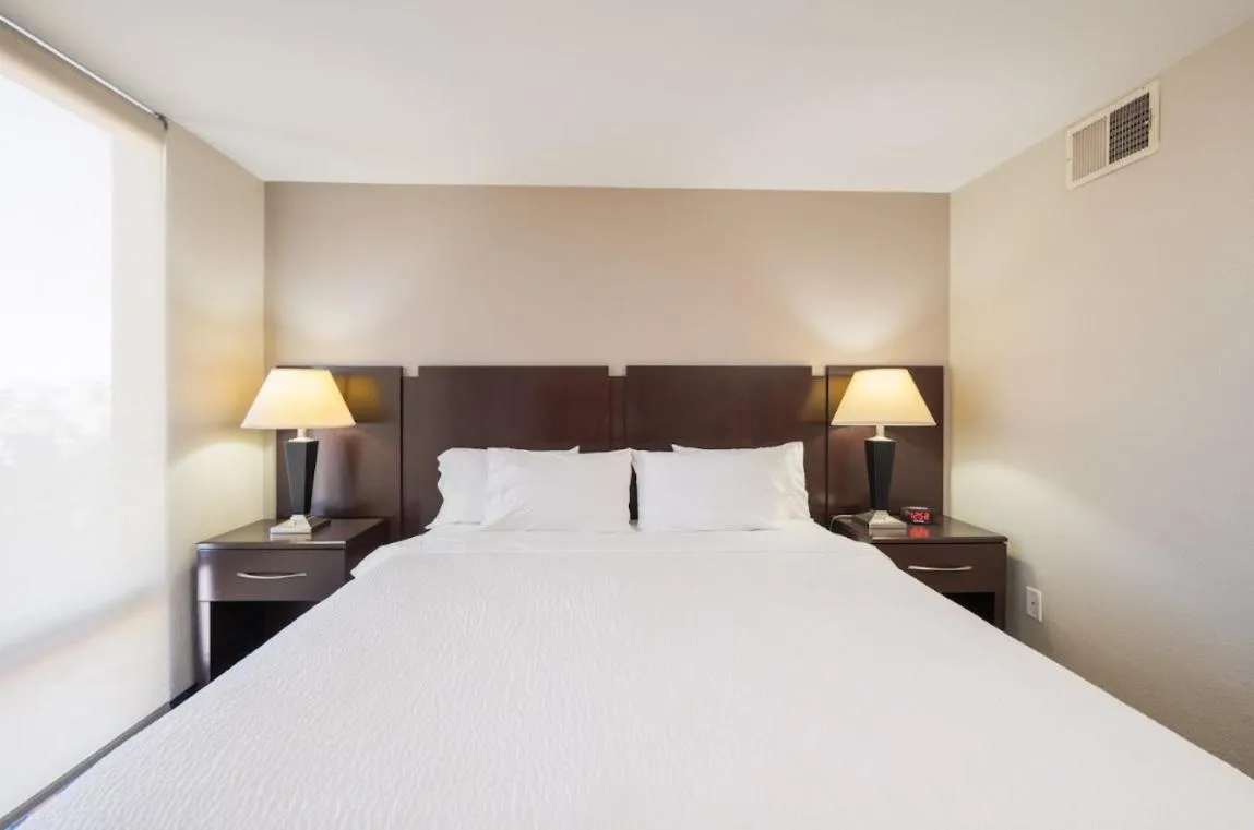 Bed in South Country Suites