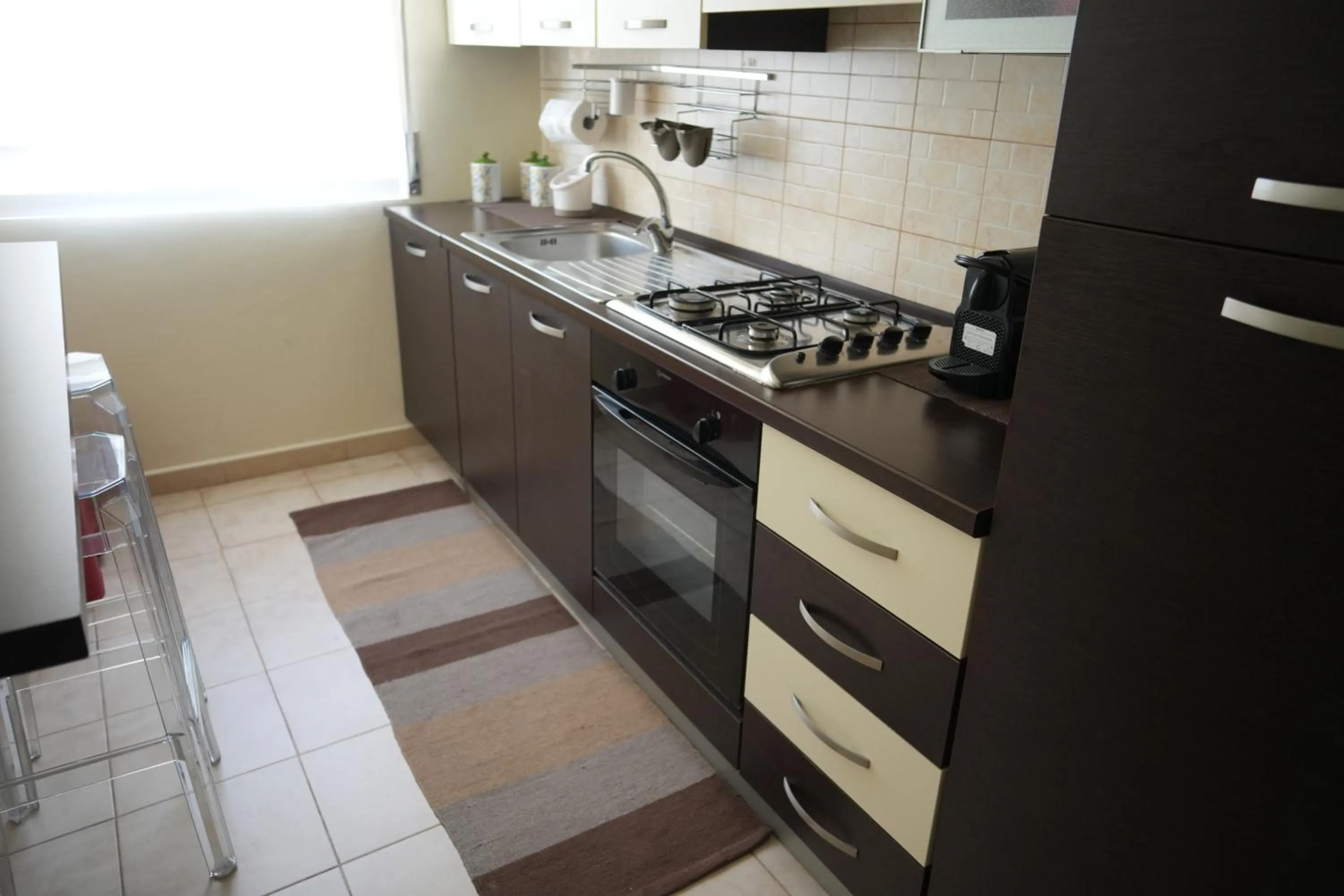 Kitchen or kitchenette in La Regina del Sole
