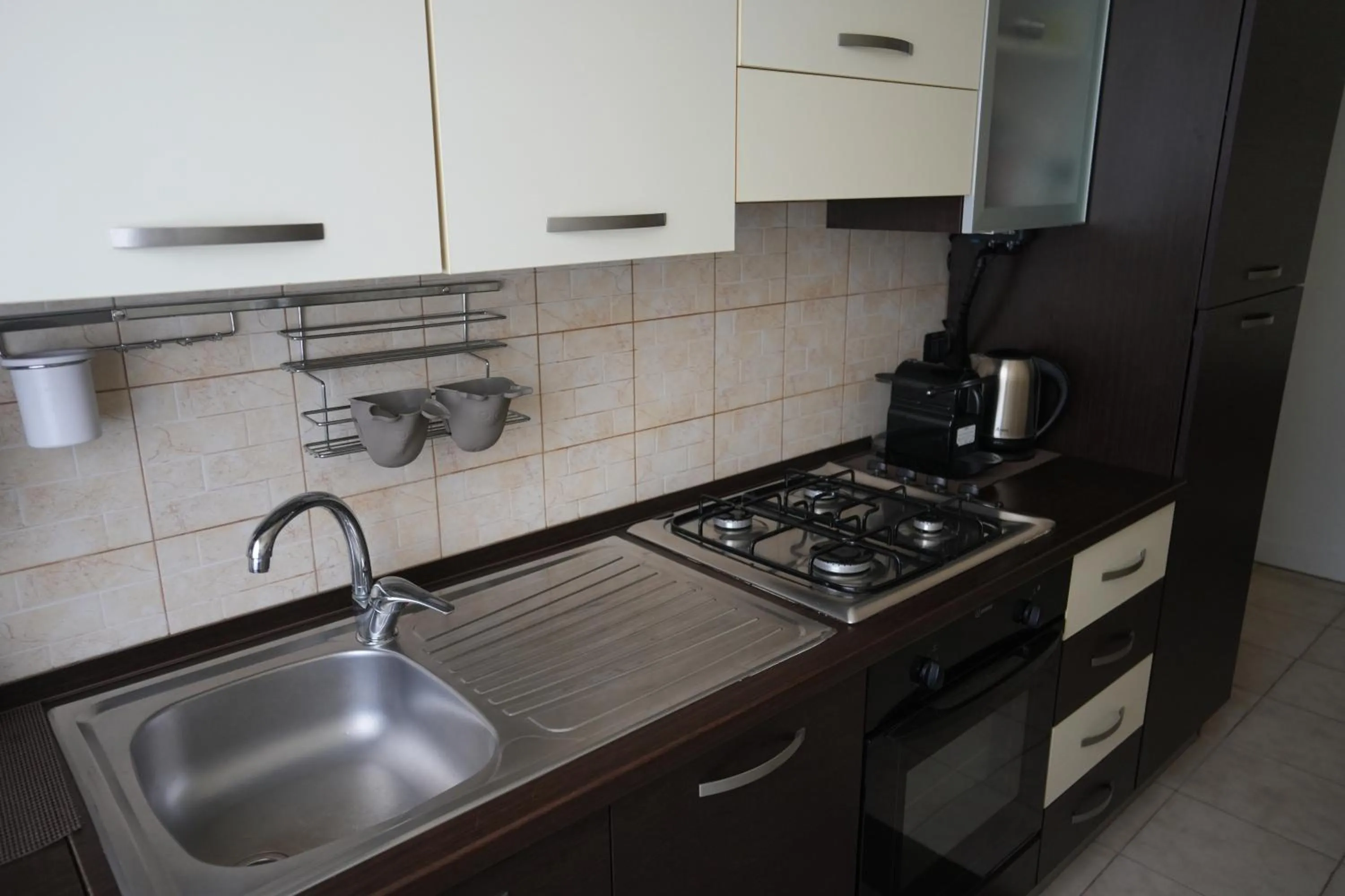 Kitchen or kitchenette in La Regina del Sole