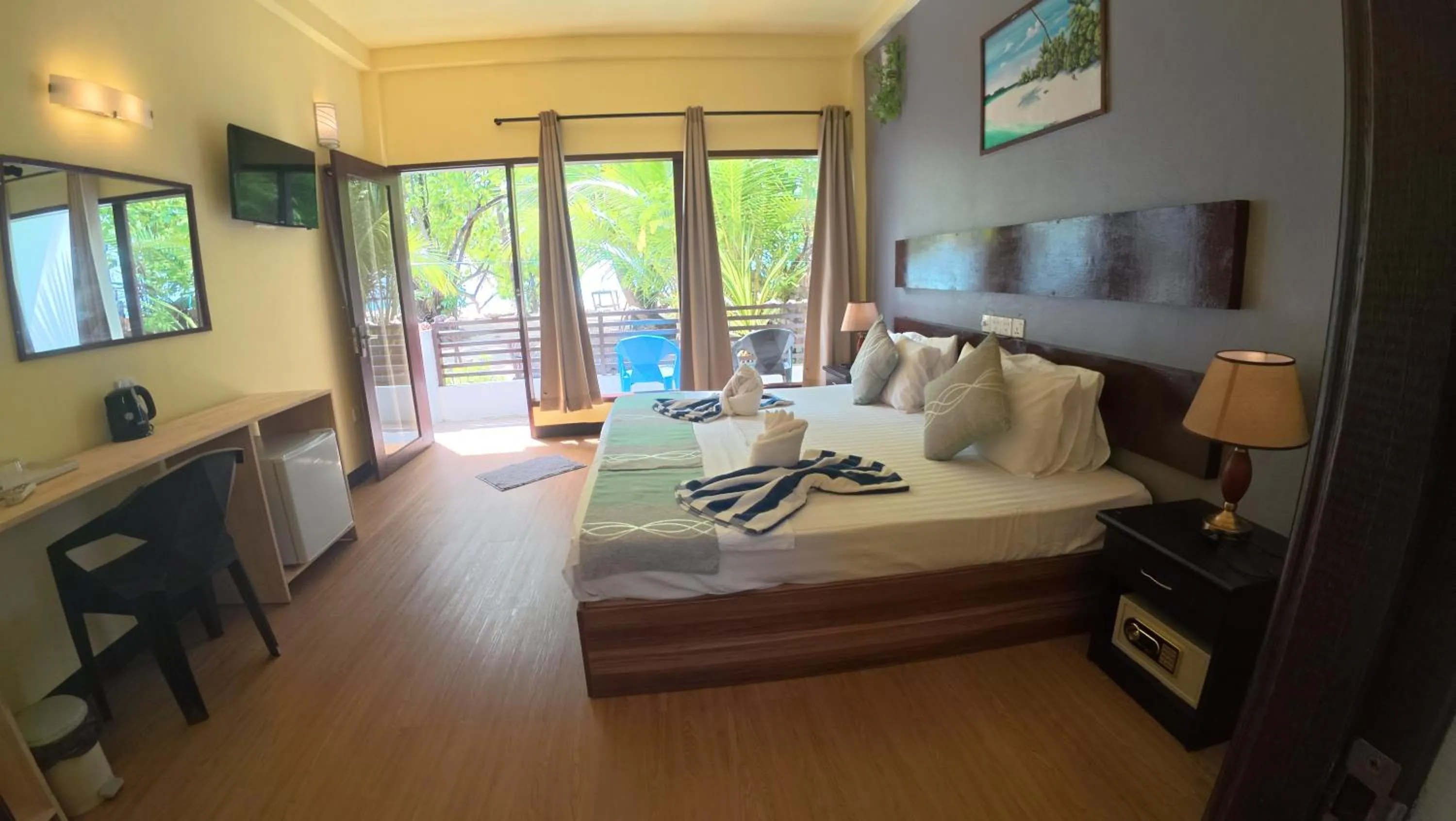 Bed in Liberty Guesthouse Maldives