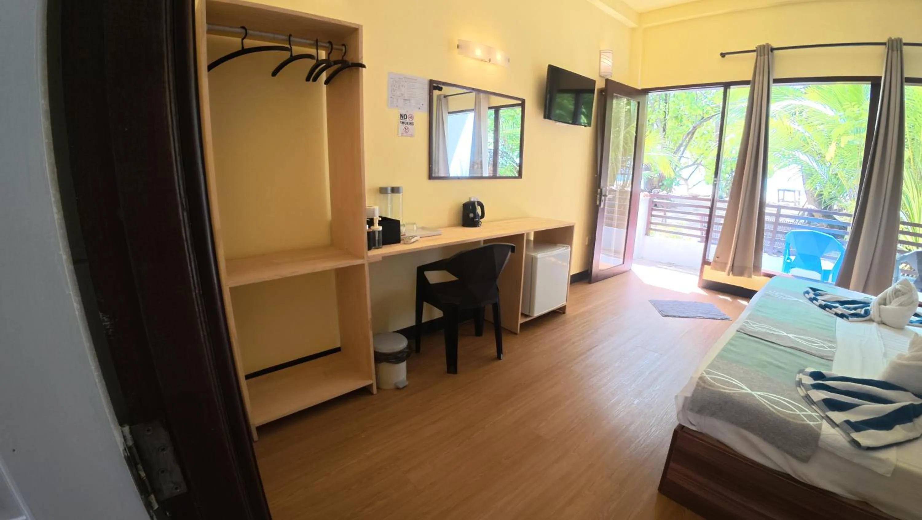 Bed in Liberty Guesthouse Maldives