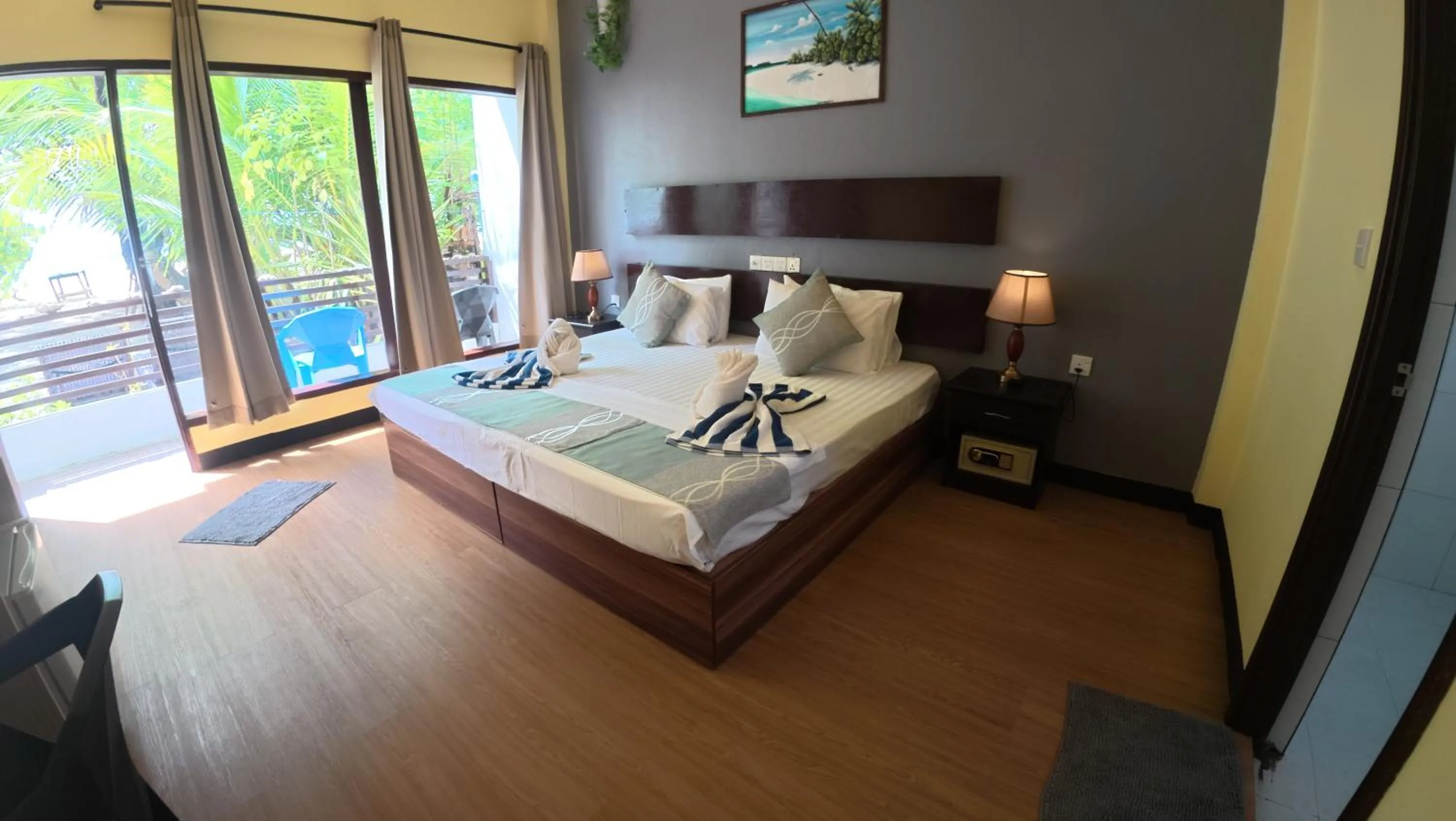 Bed in Liberty Guesthouse Maldives